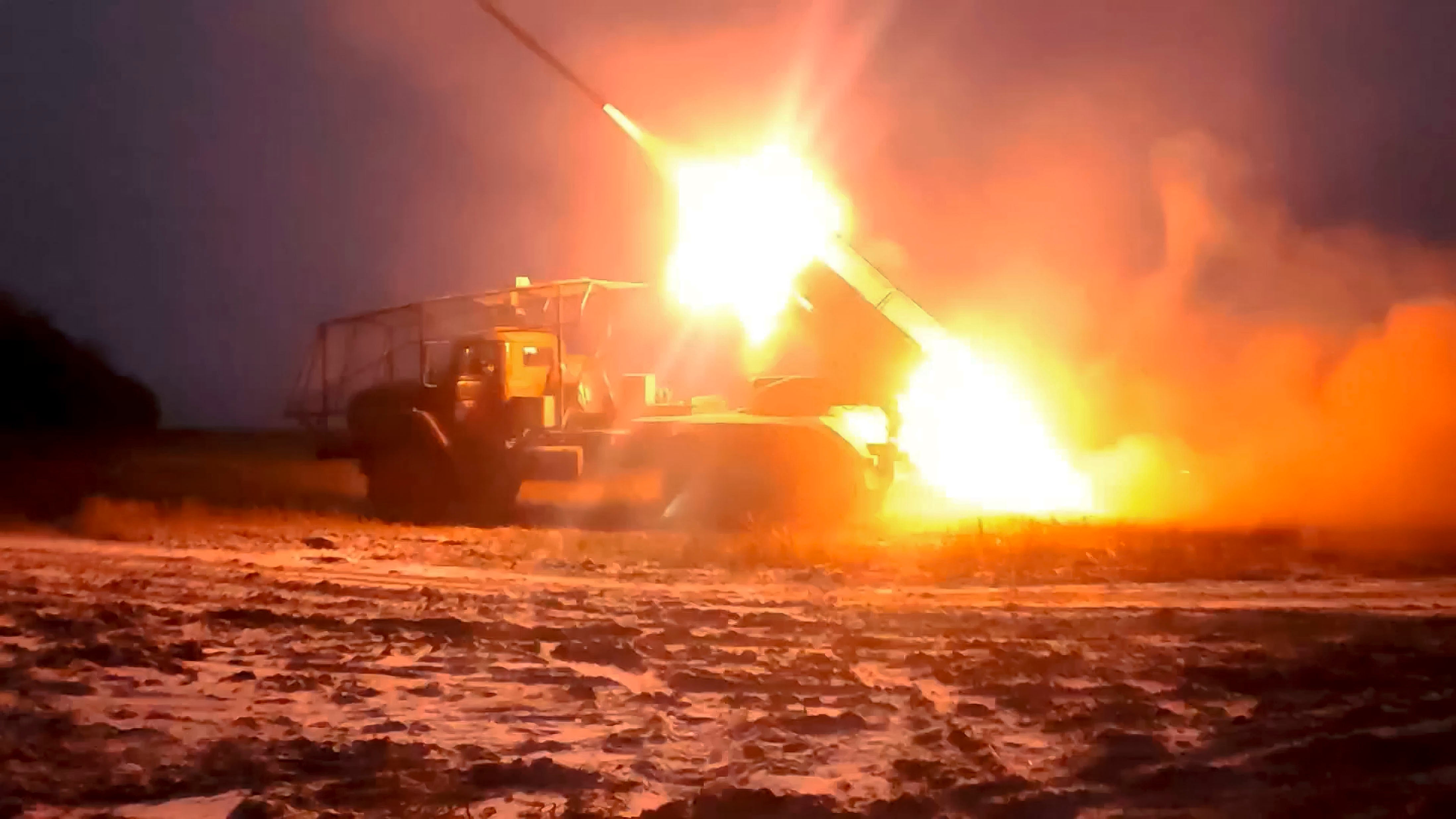 In this photo, released by the Russian Defense Ministry Press Service, a Russian "Grad" self-propelled multiple rocket launcher fires towards Ukrainian positions in Kursk