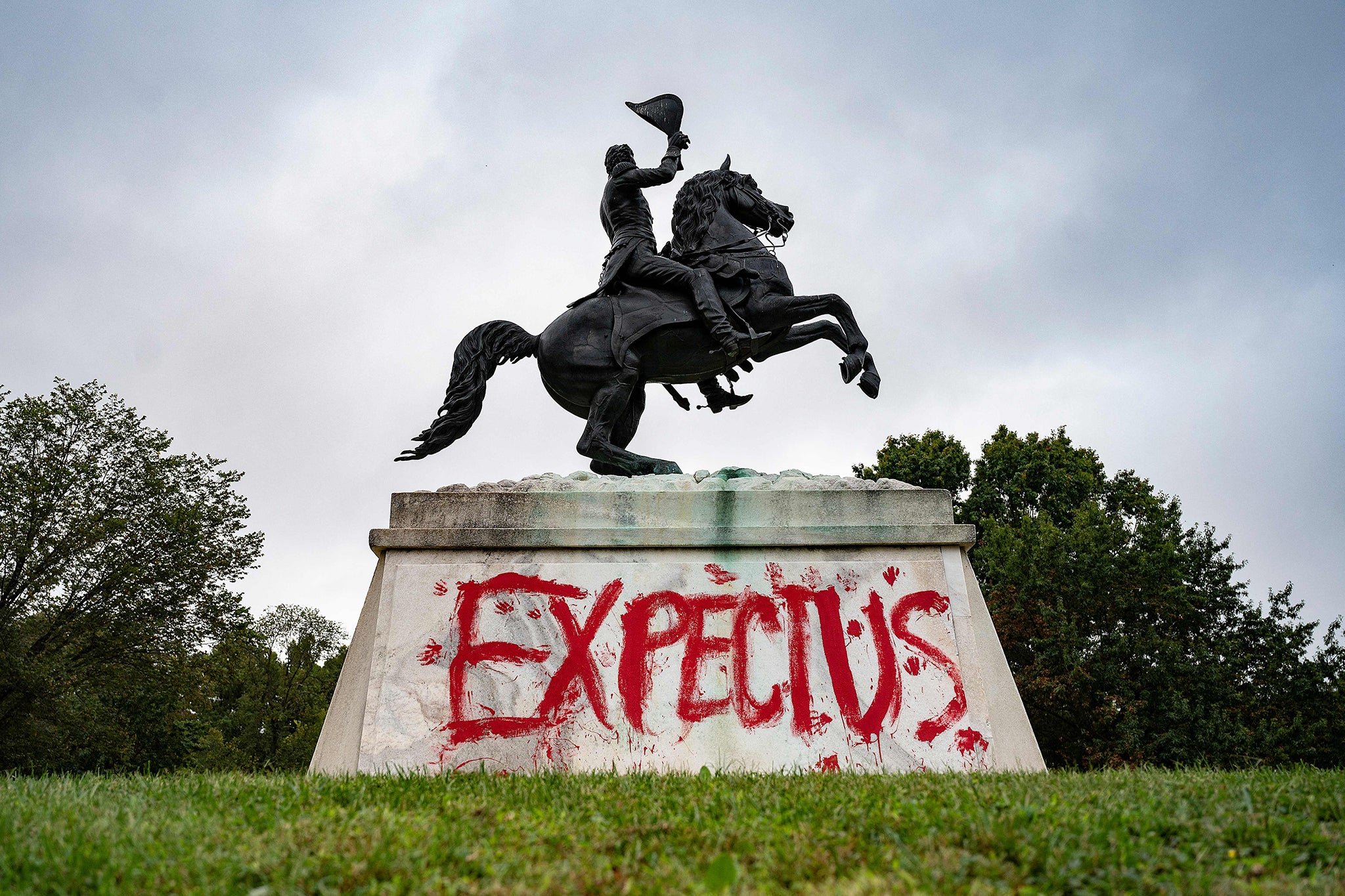 Graffiti reading “expect us” is seen on the base of the statue of US president Andrew Jackson at Lafayette Square in Washington, D.C. in 2021. President-elect Donald Trump reportedly claimed about the graffiti in the city and now wants to make the nation’s capital more ‘MAGA-friendly’