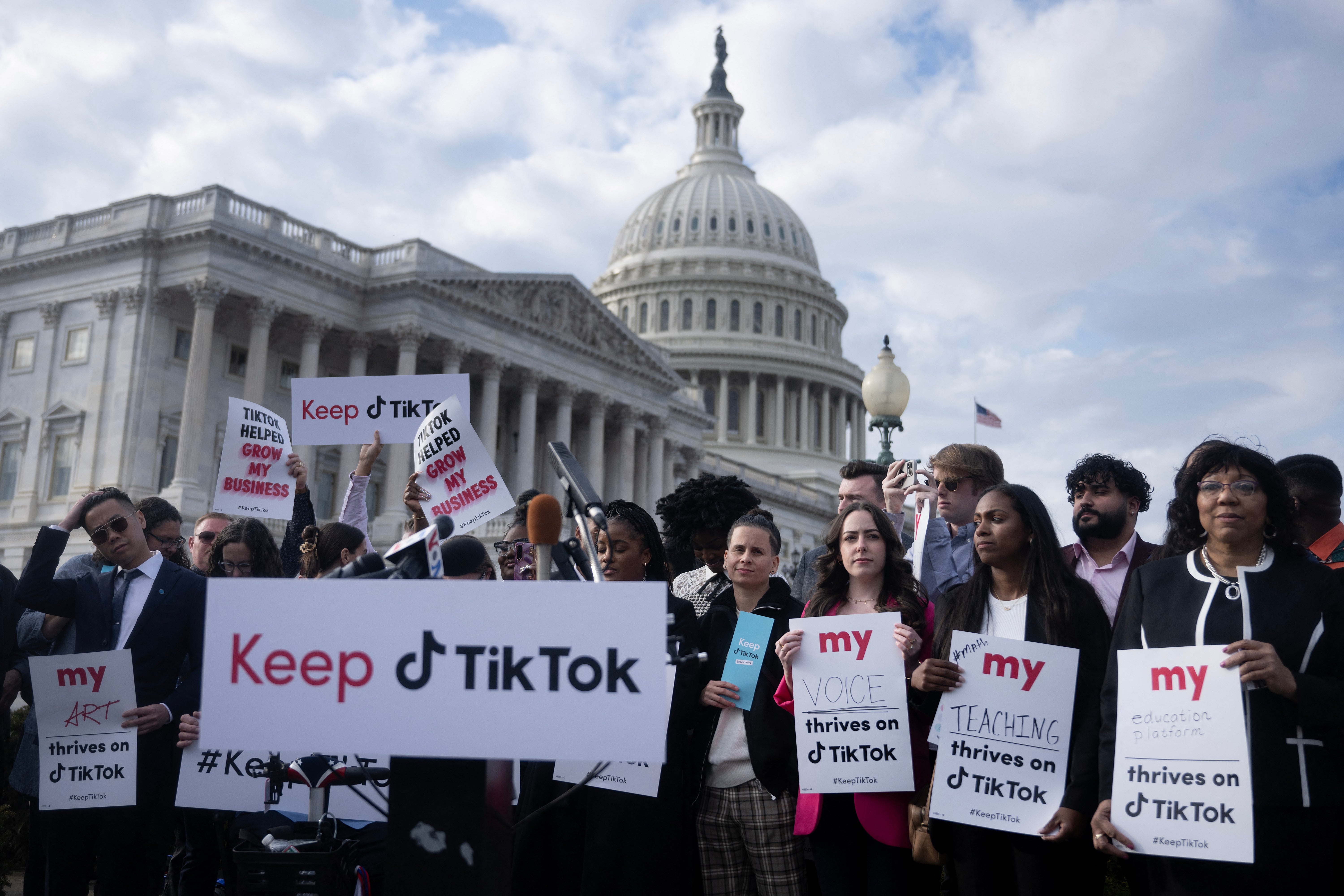 People protest a TikTok ban in December. The Biden administration is now ‘exploring options’ that could keep the app around