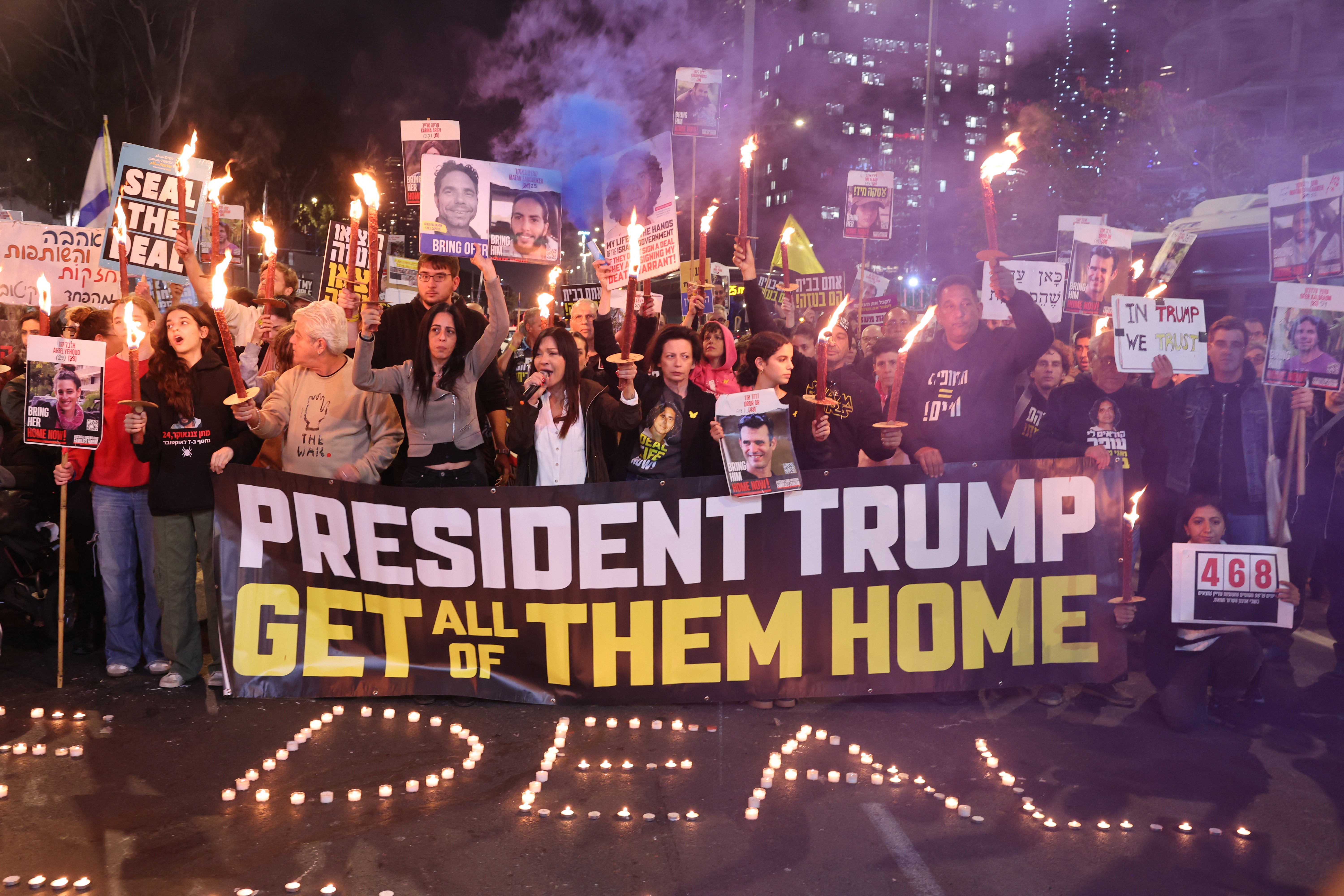 Relatives and supporters of Israeli hostages held in the Gaza Strip since the October 7, 2023 attacks by Hamas militants, gather in favour of the Gaza truce in front of the Israeli defence ministry in Tel Aviv on January 16, 2025 (Photo by JACK GUEZ/AFP via Getty Images)