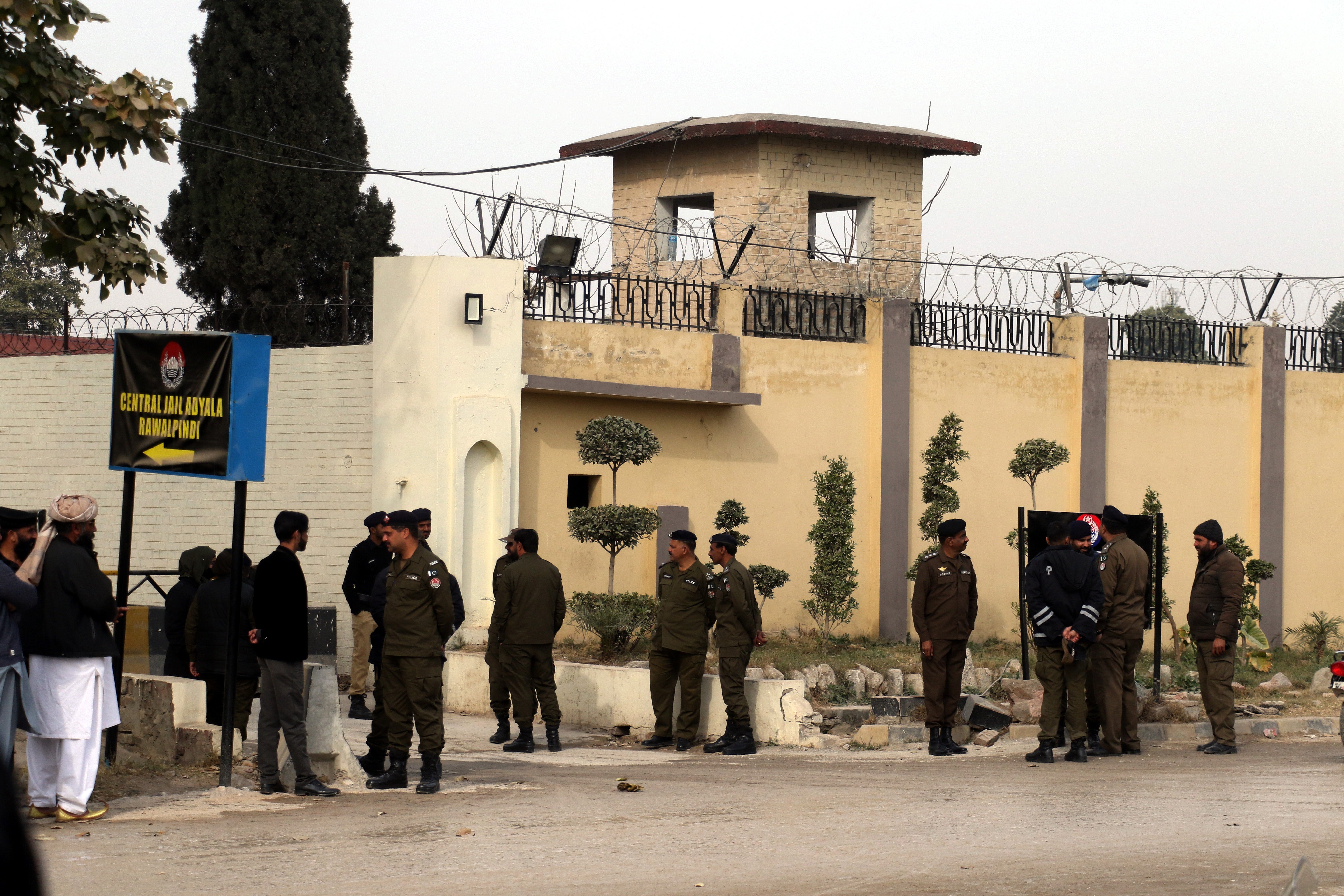 Pakistani security officials stand outside the Adiala Prison during the hearing in a case related to the Al-Qadir University Project Trust, in Rawalpindi, Pakistan
