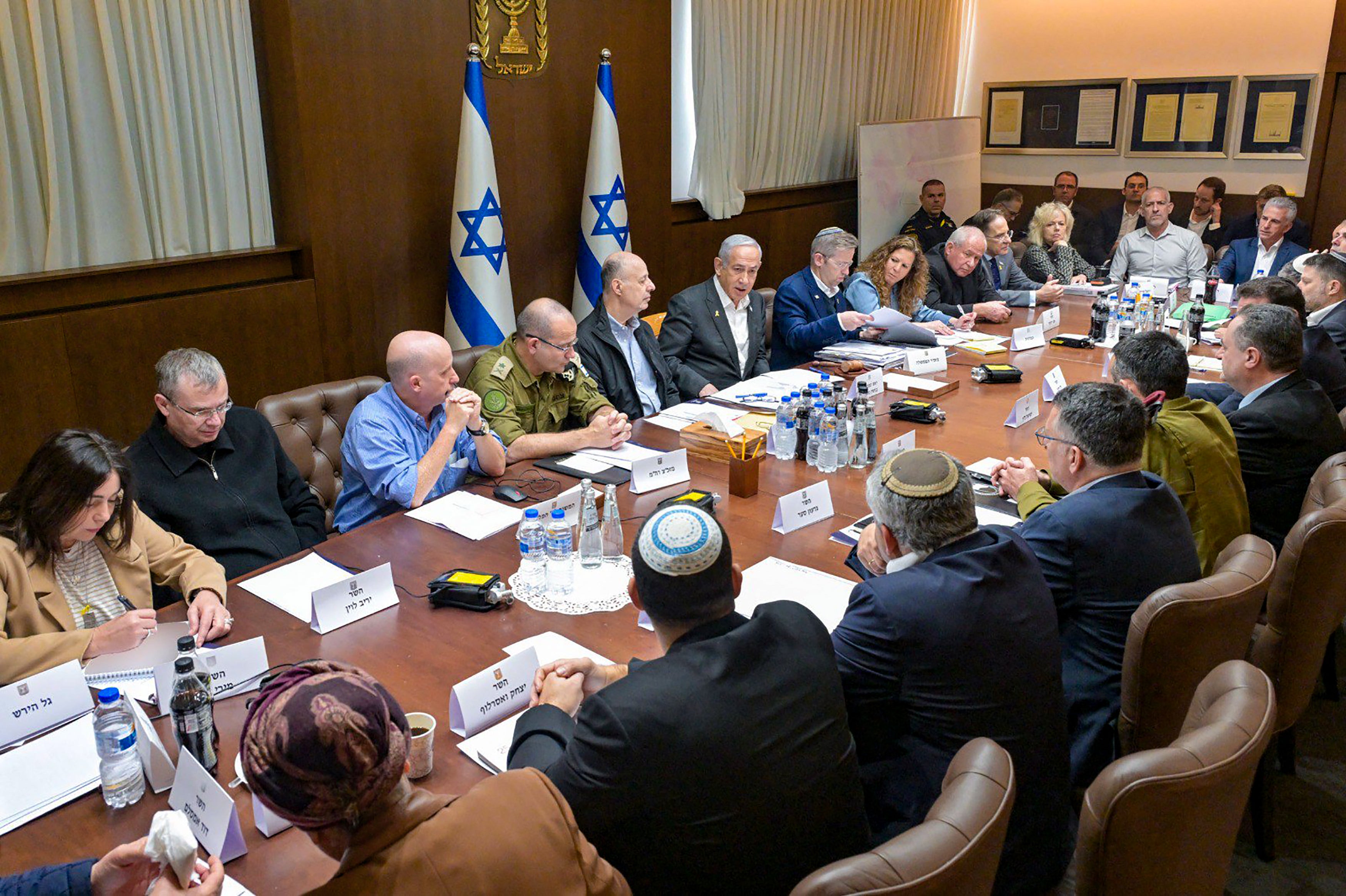 Benjamin Netanyahu, sixth from left, heads the security cabinet meeting in Jerusalem on Friday