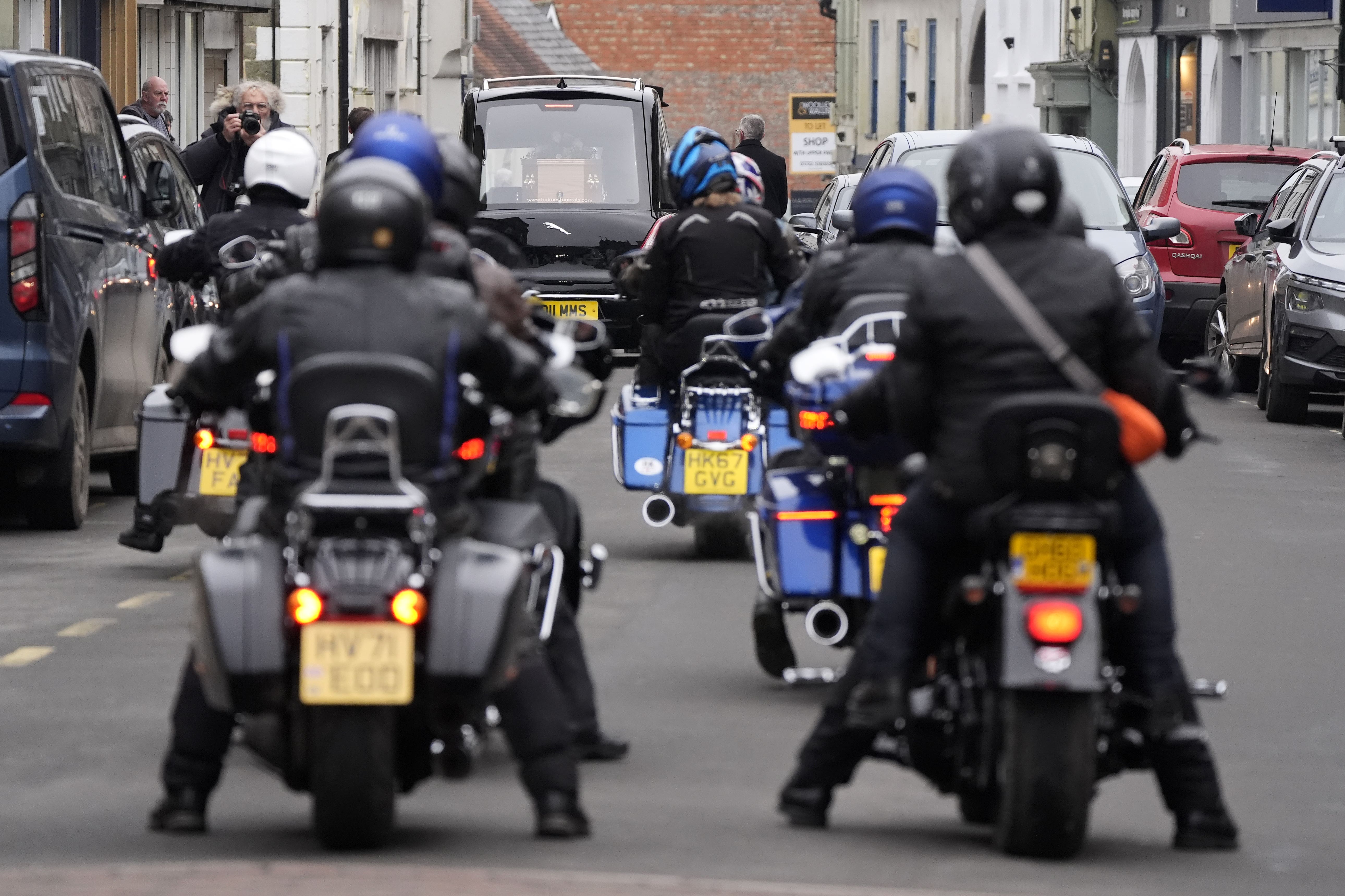 Harley Davidson riders ride behind the hearse in tribute following the funeral of DJ Johnnie Walker (Andrew Matthews/PA)