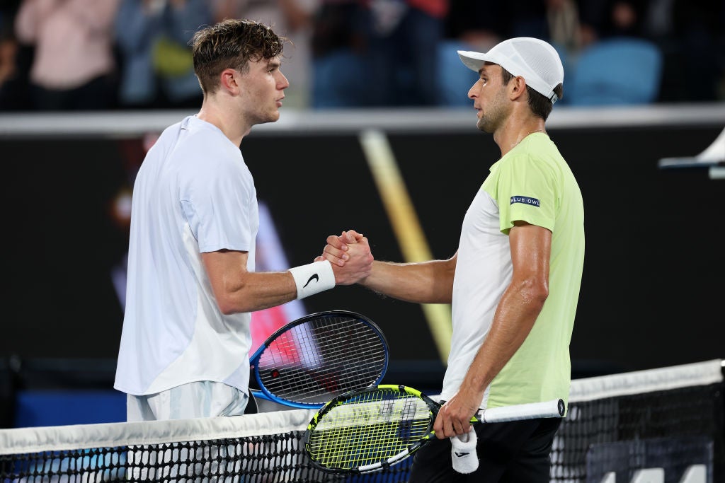 Draper and Vukic exchange pleasantries at the end of the match