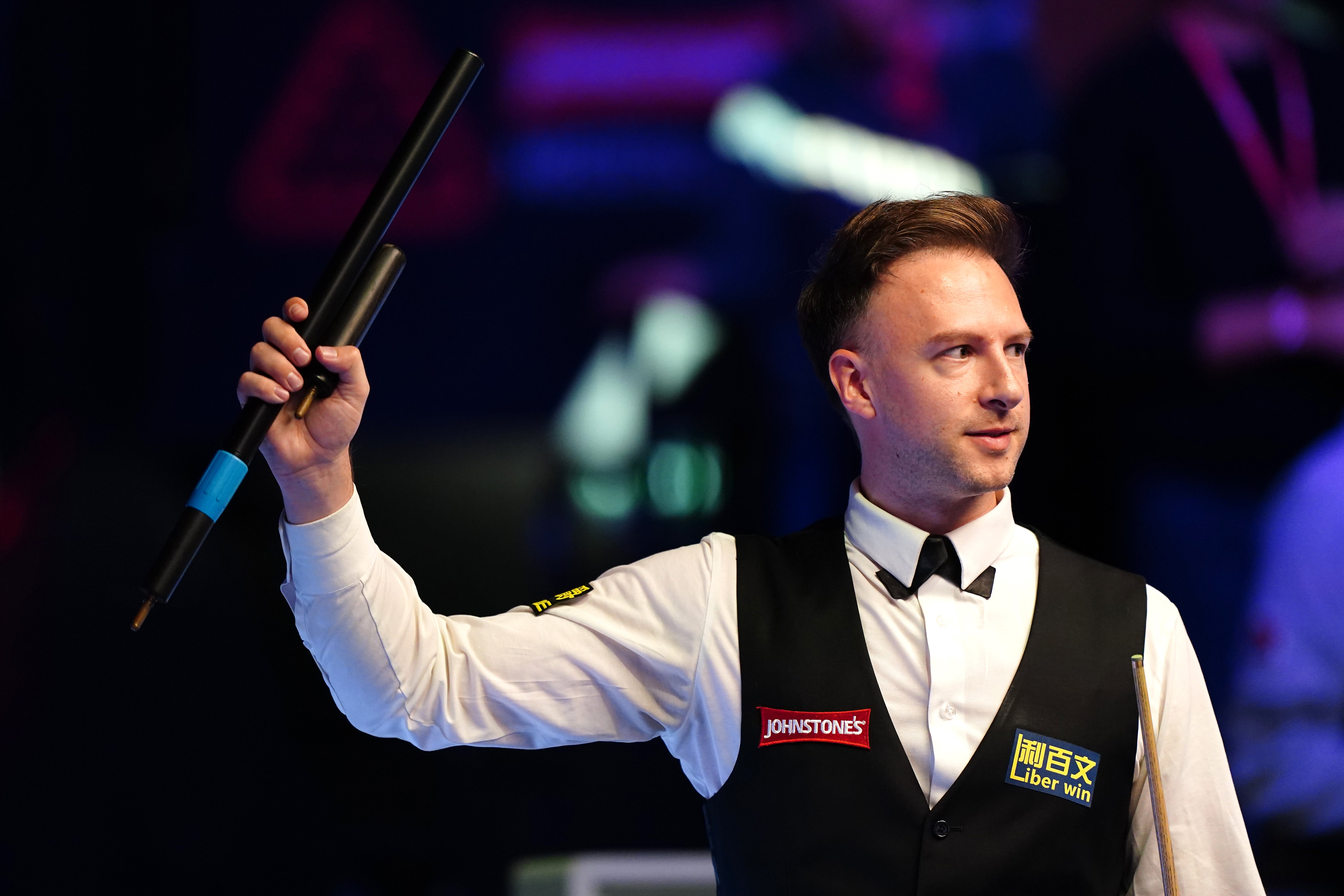 Judd Trump salutes the crowd after beating Ding Junhui in the quarter-finals