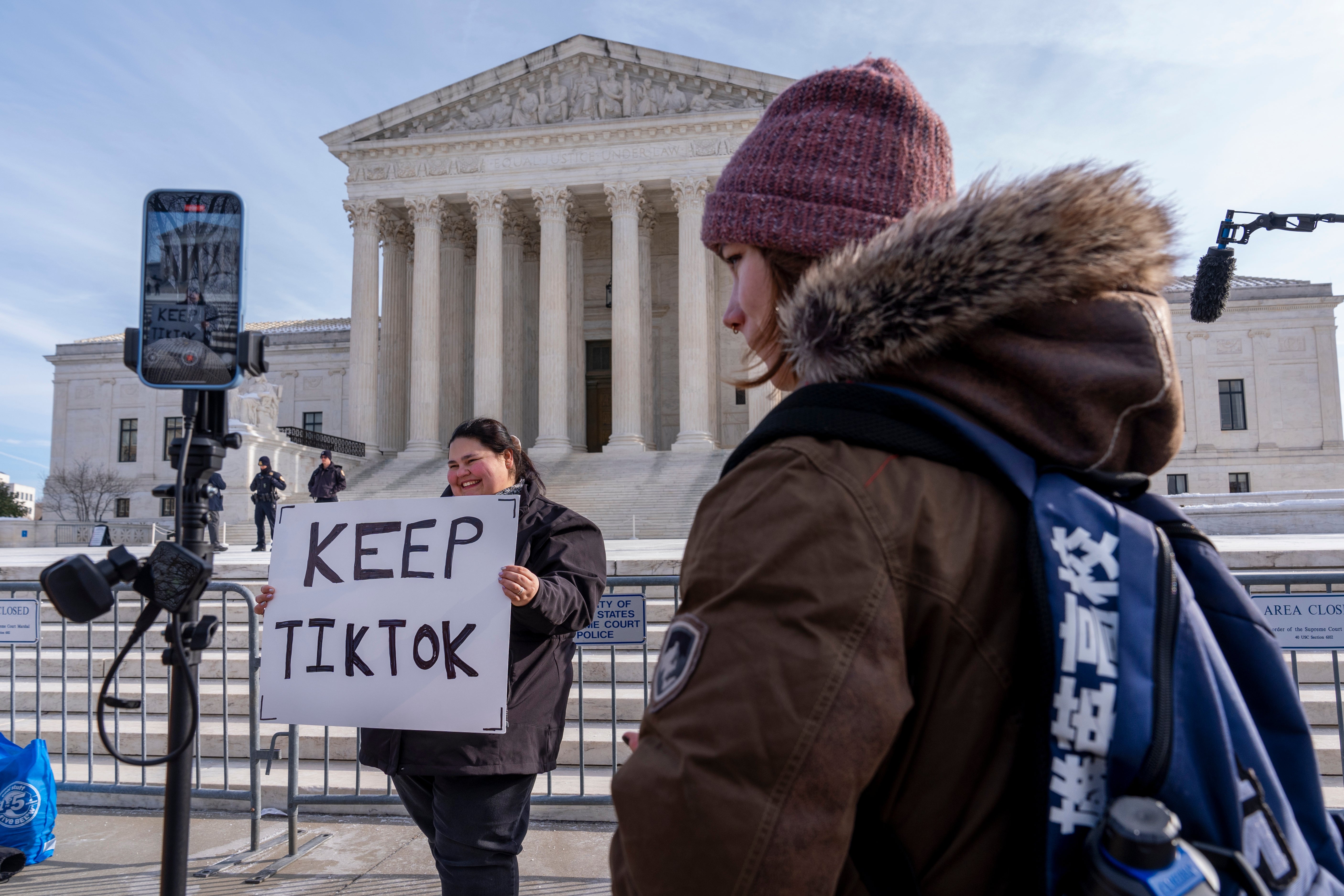 Callie Goodwin, holds a sign in support of TikTok outside the Supreme Court on Friday in Washington, D.C. TikTok is set to go dark in the U.S. as soon as Sunday