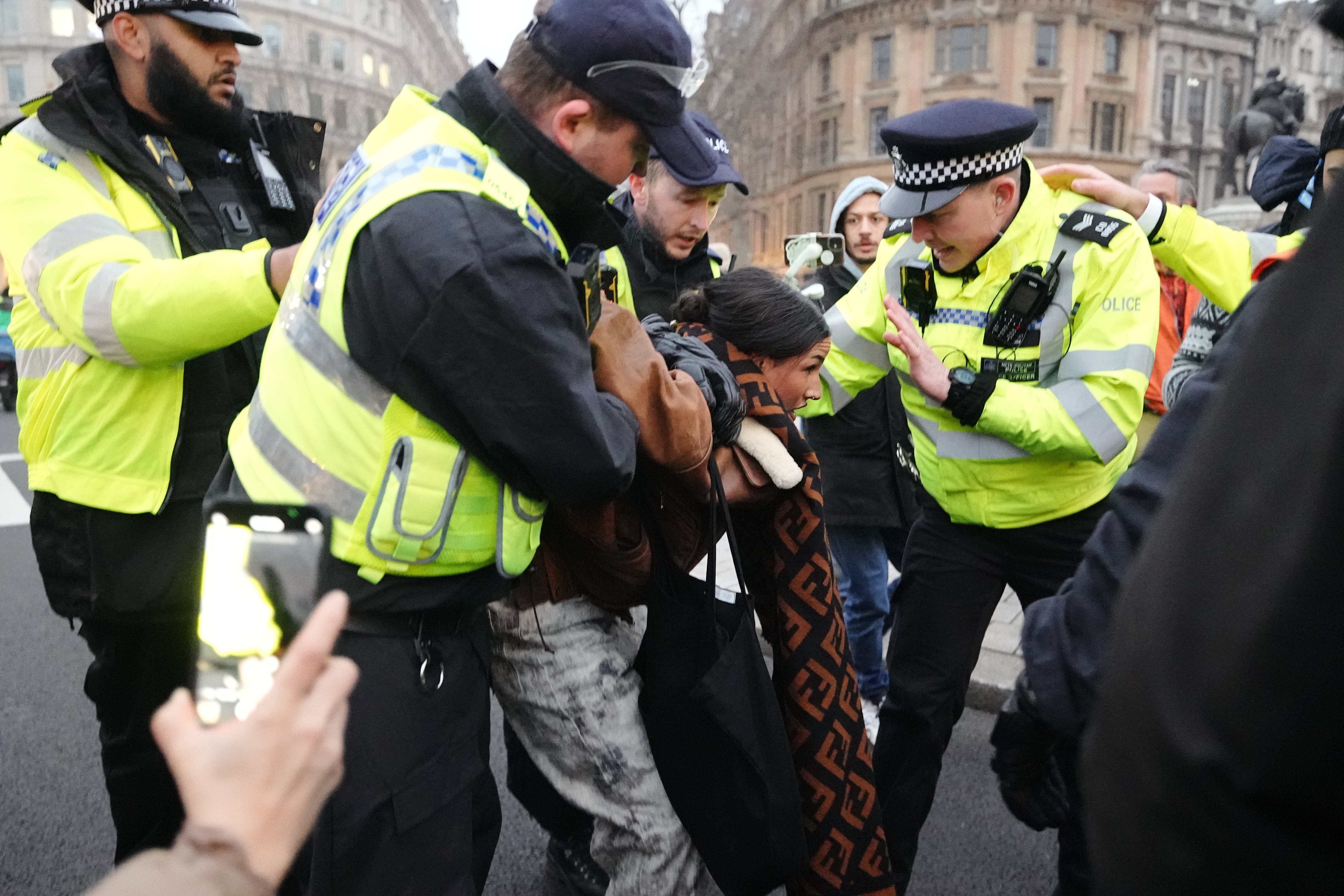 A protester is arrested near Trafalgar Square on Saturday