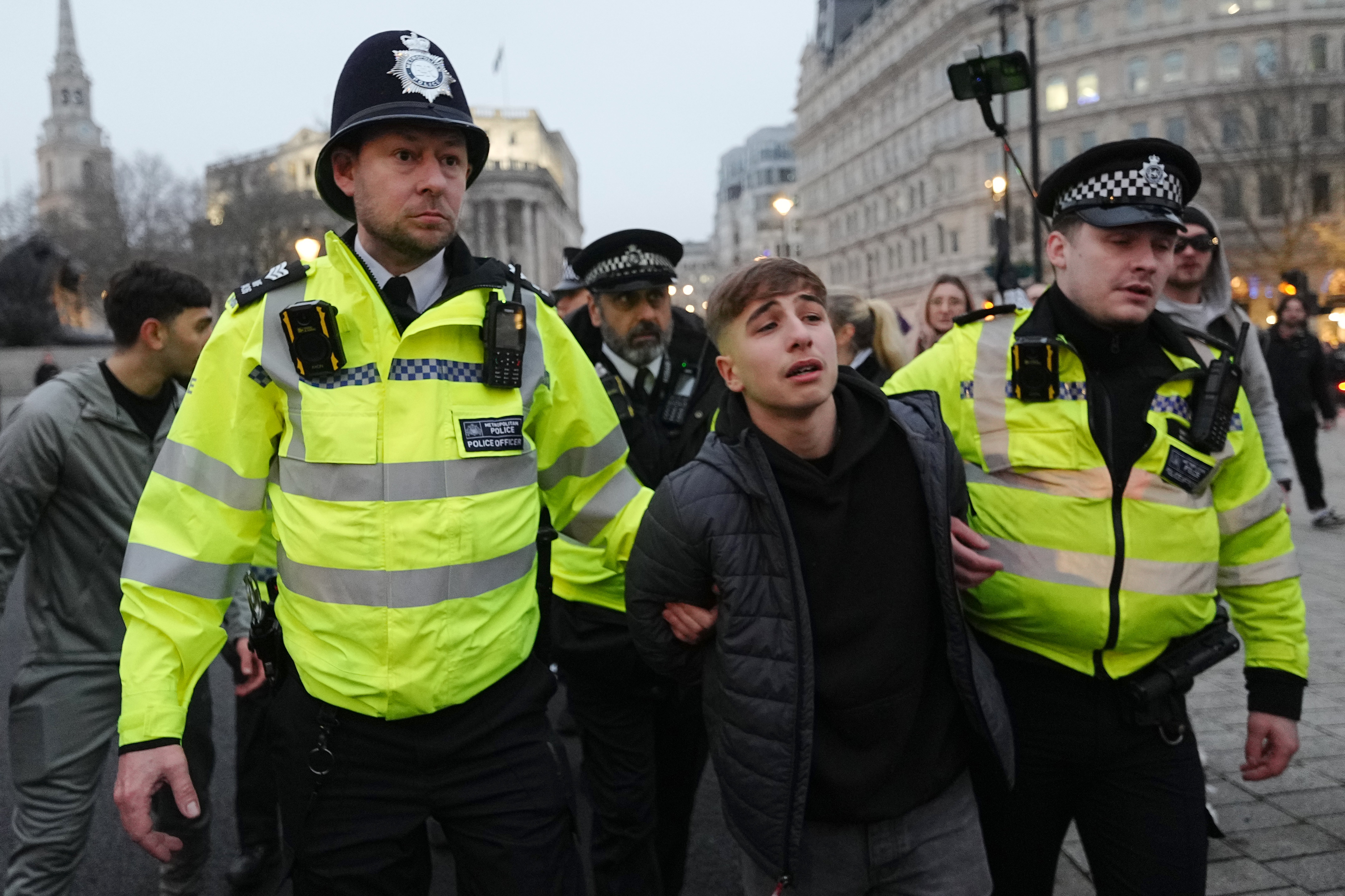 A pro-Palestinian protester is led away by police