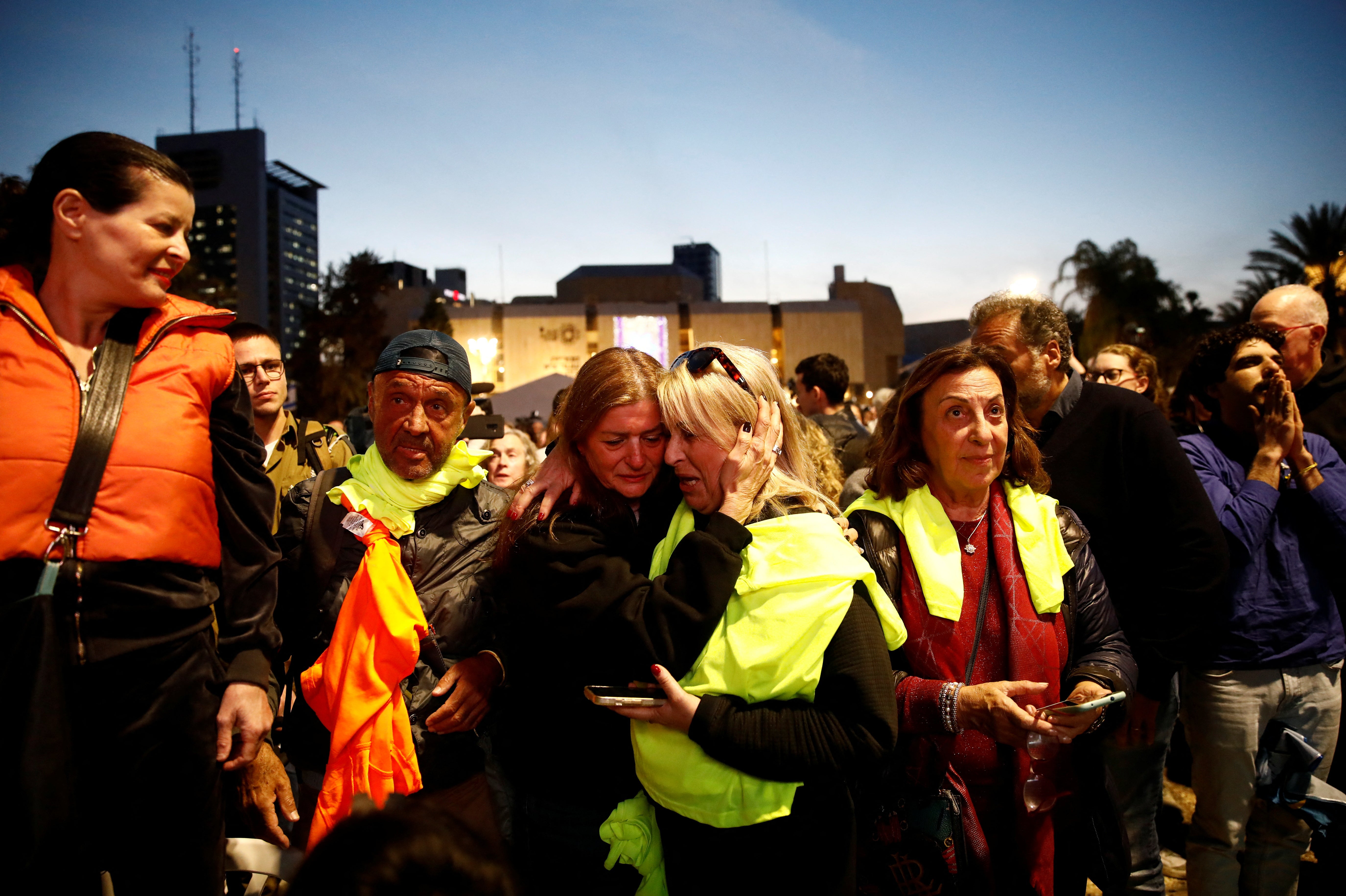 Crowds gather in Tel Aviv to watch the long-awaited release of the hostages