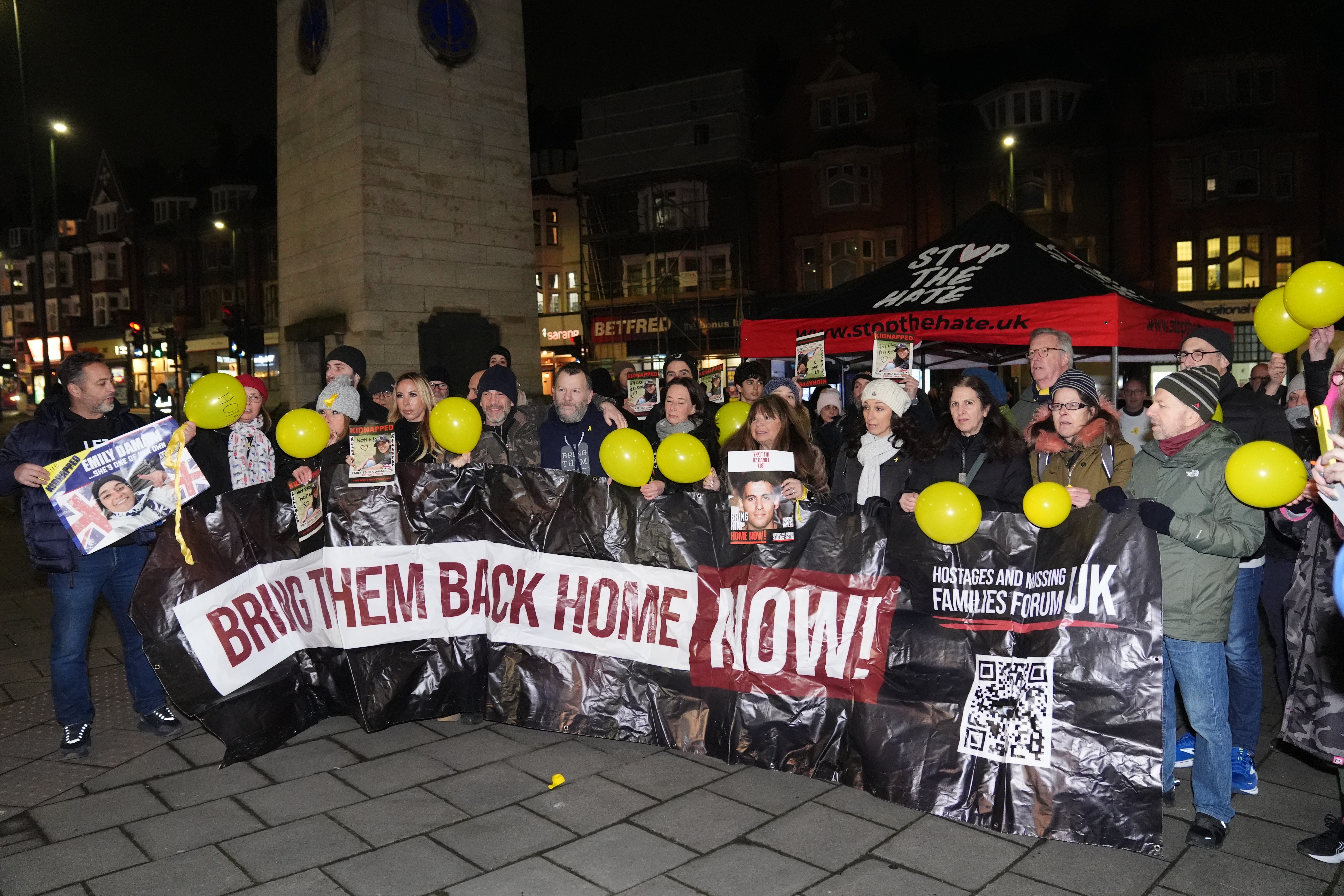 People gathered at the Golders Green War Memorial after Emily Damari’s release (Ben Whitley/PA)