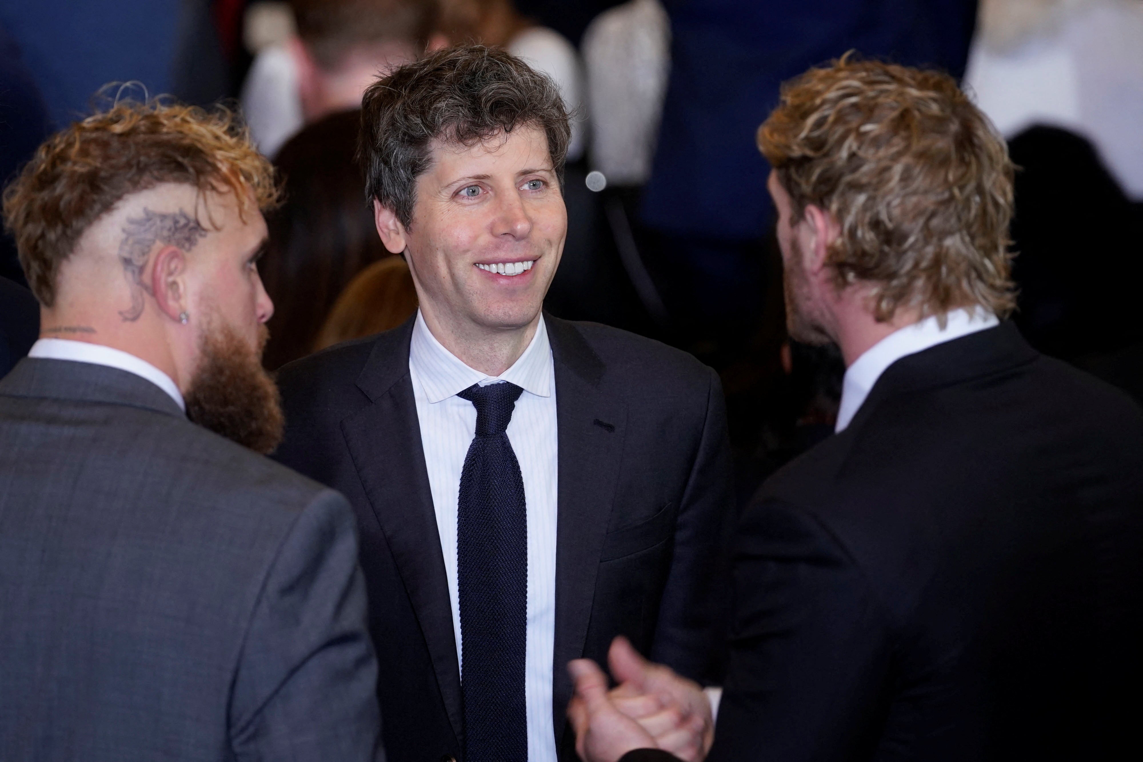 OpenAI CEO Sam Altman (center) talks to viral YouTube brothers Jake and Logan Paul (left and right, respectively)
