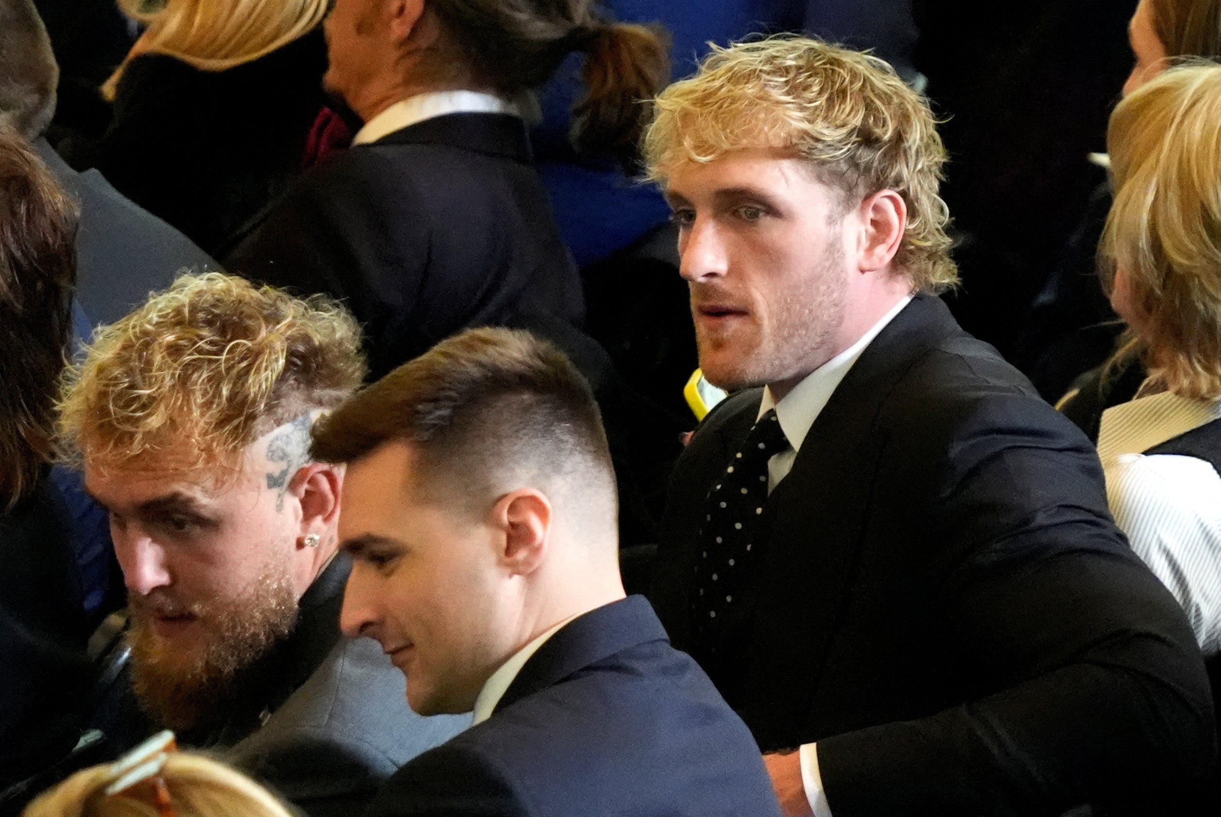 Logan Paul (right), who rose to fame with his YouTube content and is now a professional wrestler, is seen at the inauguration alongside his brother, boxer Jake Paul (left)