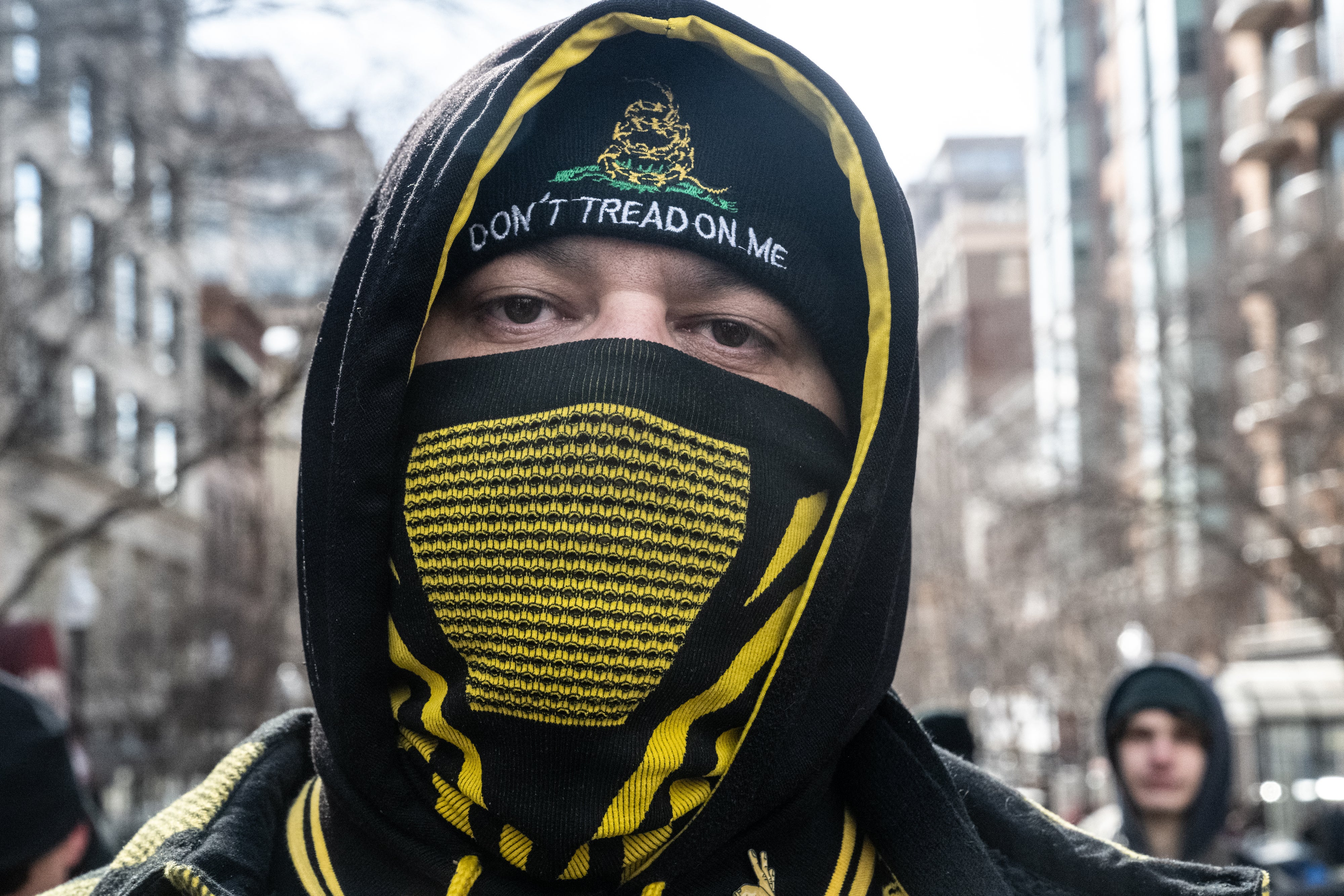 A member of the Proud Boys walks through DC to celebrate Trump's inauguration