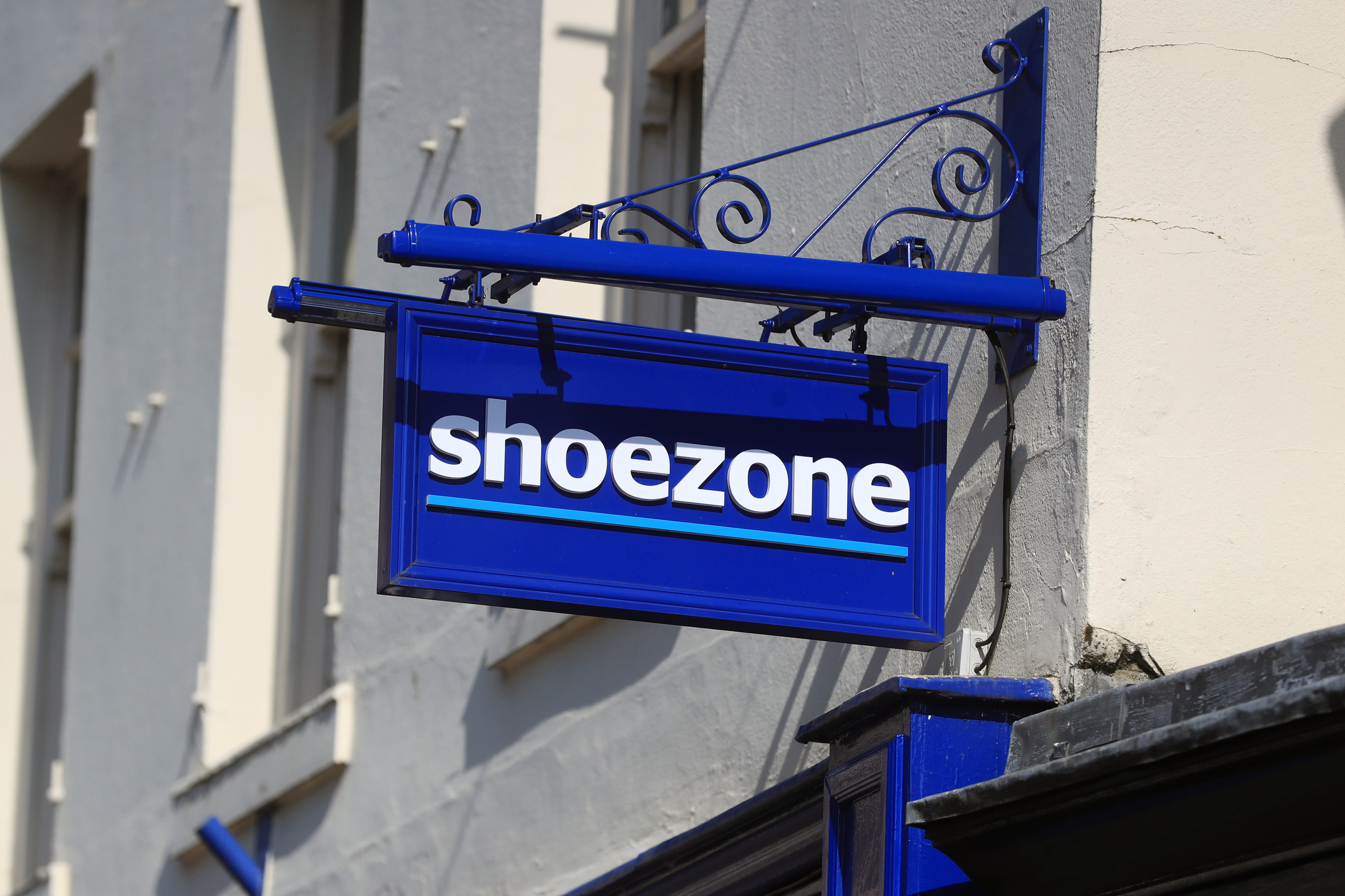 Retailer Shoe Zone has seen shares slump after revealing tumbling annual sales and profits (PA)