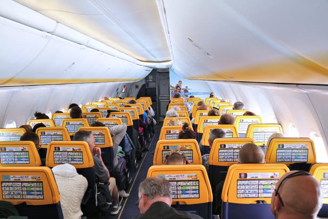 <p>Cabin interior of a Boeing 737-800 RyanAir passenger airplane </p>