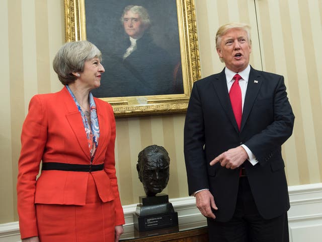 <p>Donald Trump and Theresa May posing with the bust of Winston Churchill in the Oval Office in 2017</p>