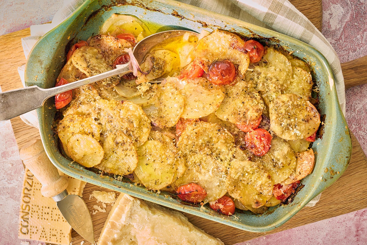 Humble potatoes elevated with layers of parmesan and a touch of oregano