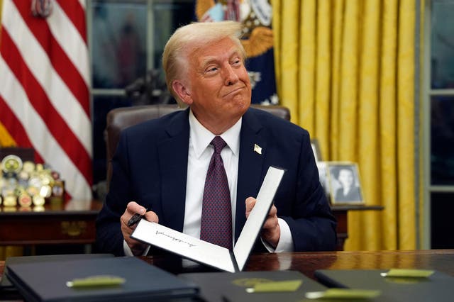 <p>President Donald Trump signs executive orders in the Oval Office of the White House, Monday, Jan. 20, 2025, in Washington</p>