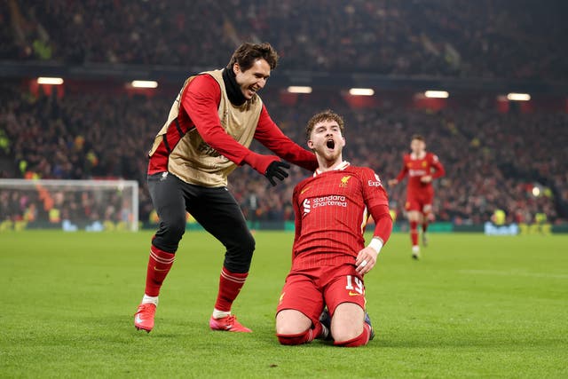 <p>Harvey Elliott celebrates after seeing his shot deflect into the net</p>