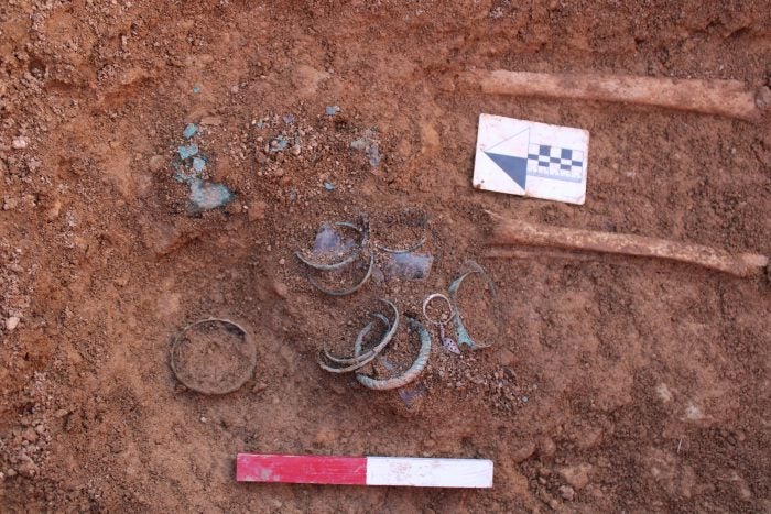 Another grave found with silver earrings, copper alloy bracelets, copper alloy rings