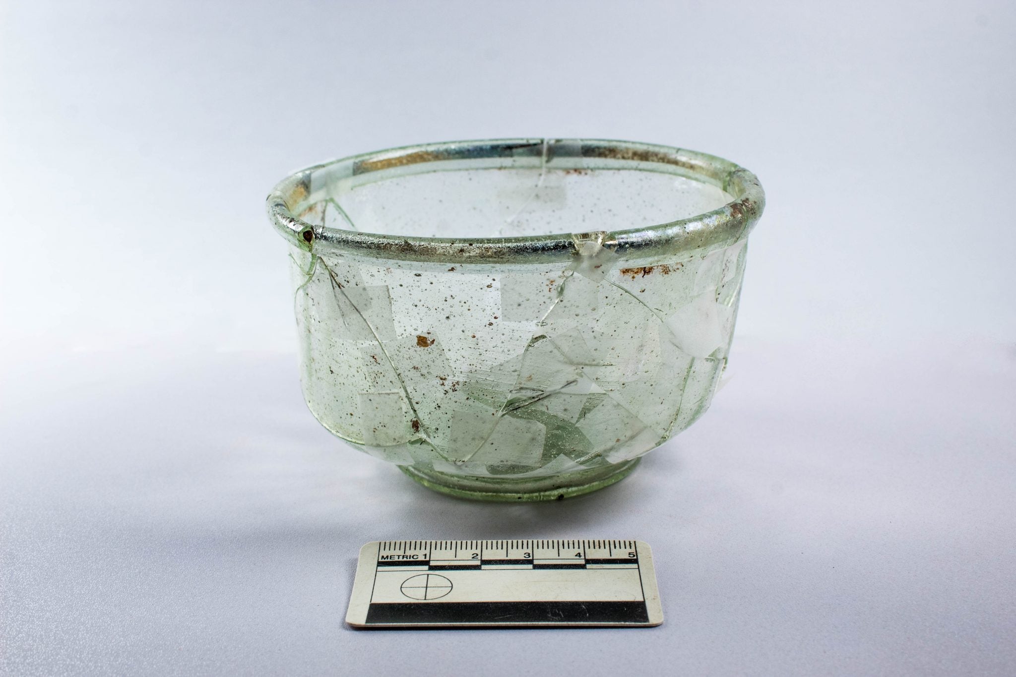 Glass vessel found buried near coffin
