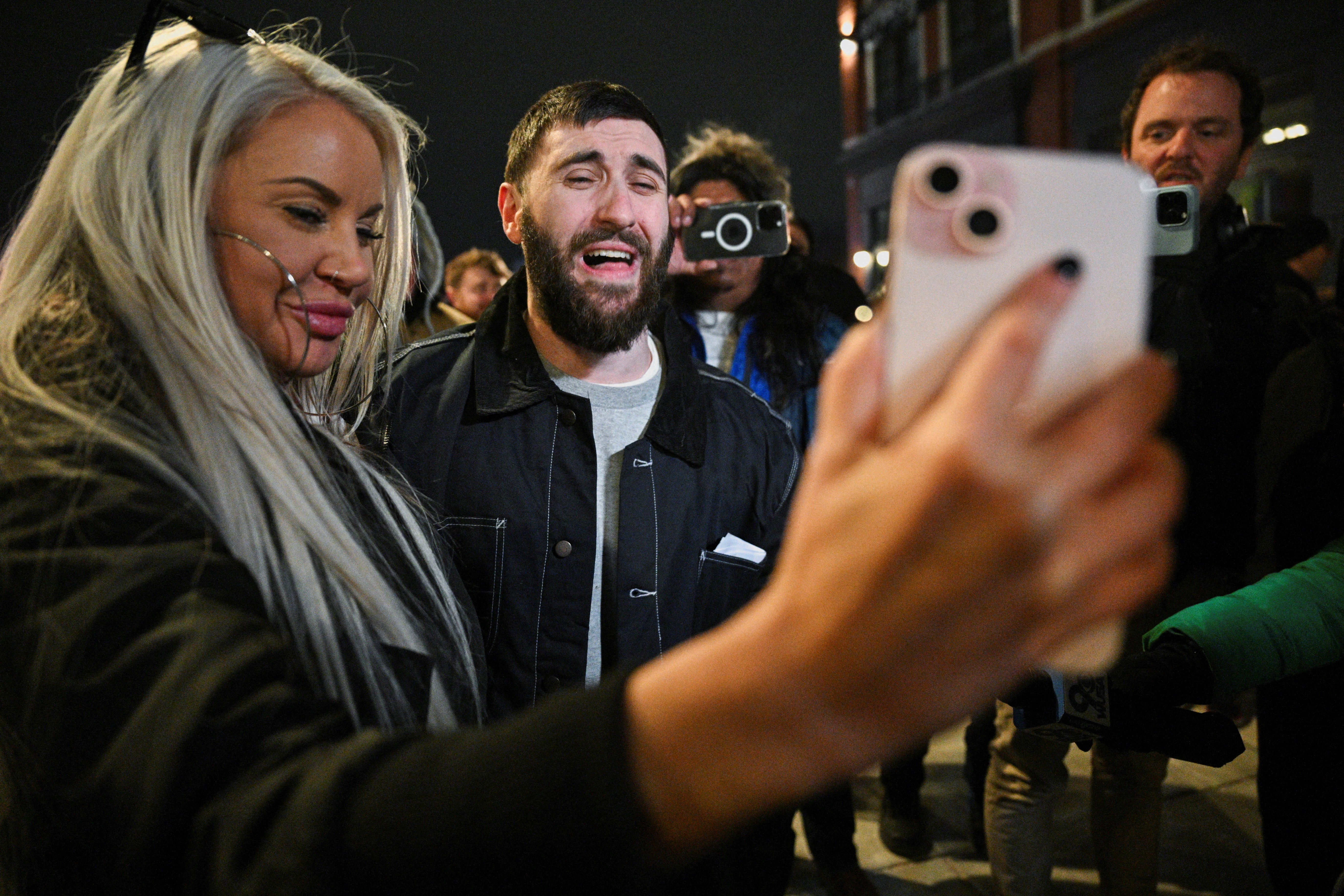 Lang celebrates with his fiance and fellow Jan 6-er Rachel Myers after they are pardoned by President Donald Trump