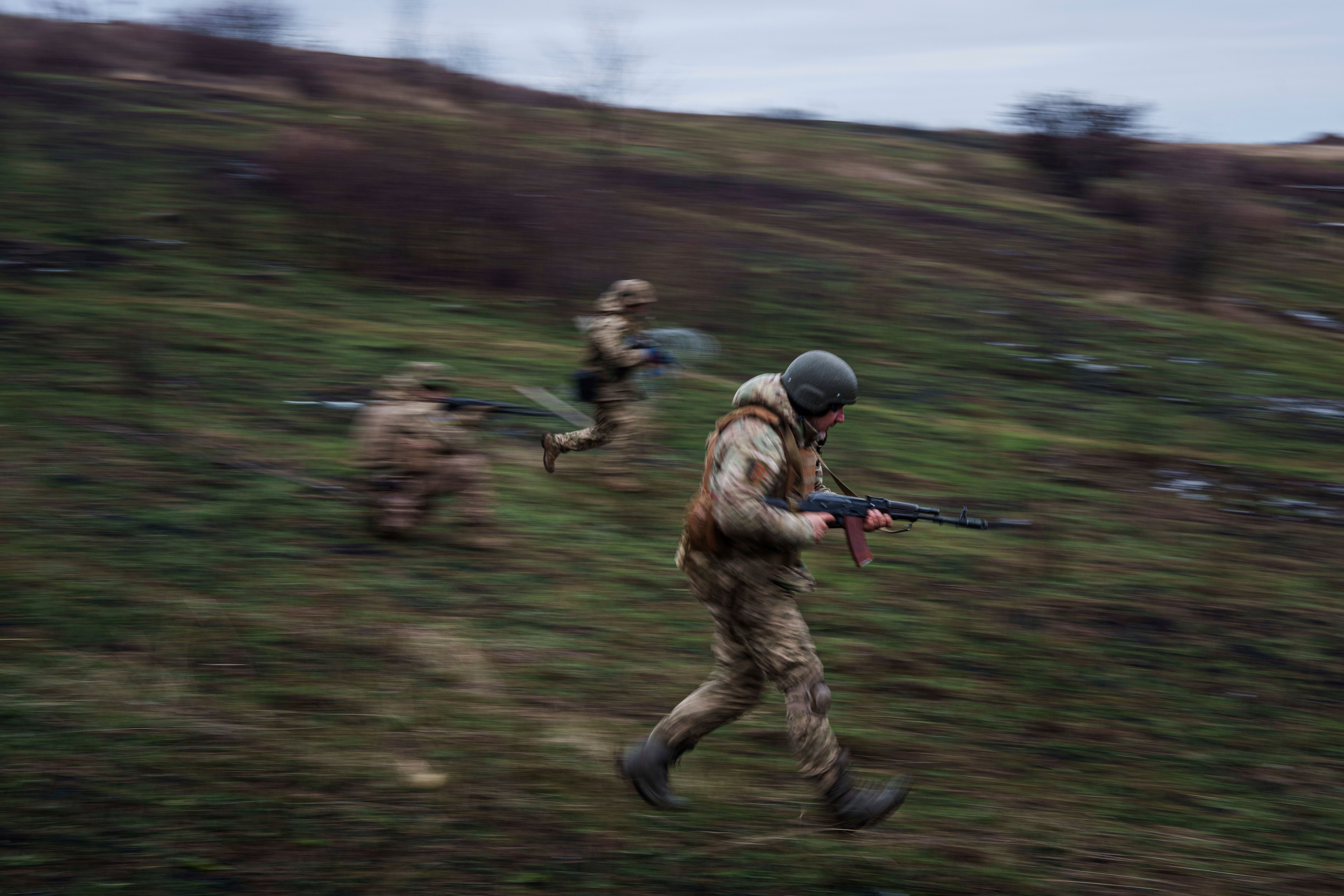 Ukrainian servicemen of 24th Mechanised brigade train at the polygon not far from frontline in Donetsk region