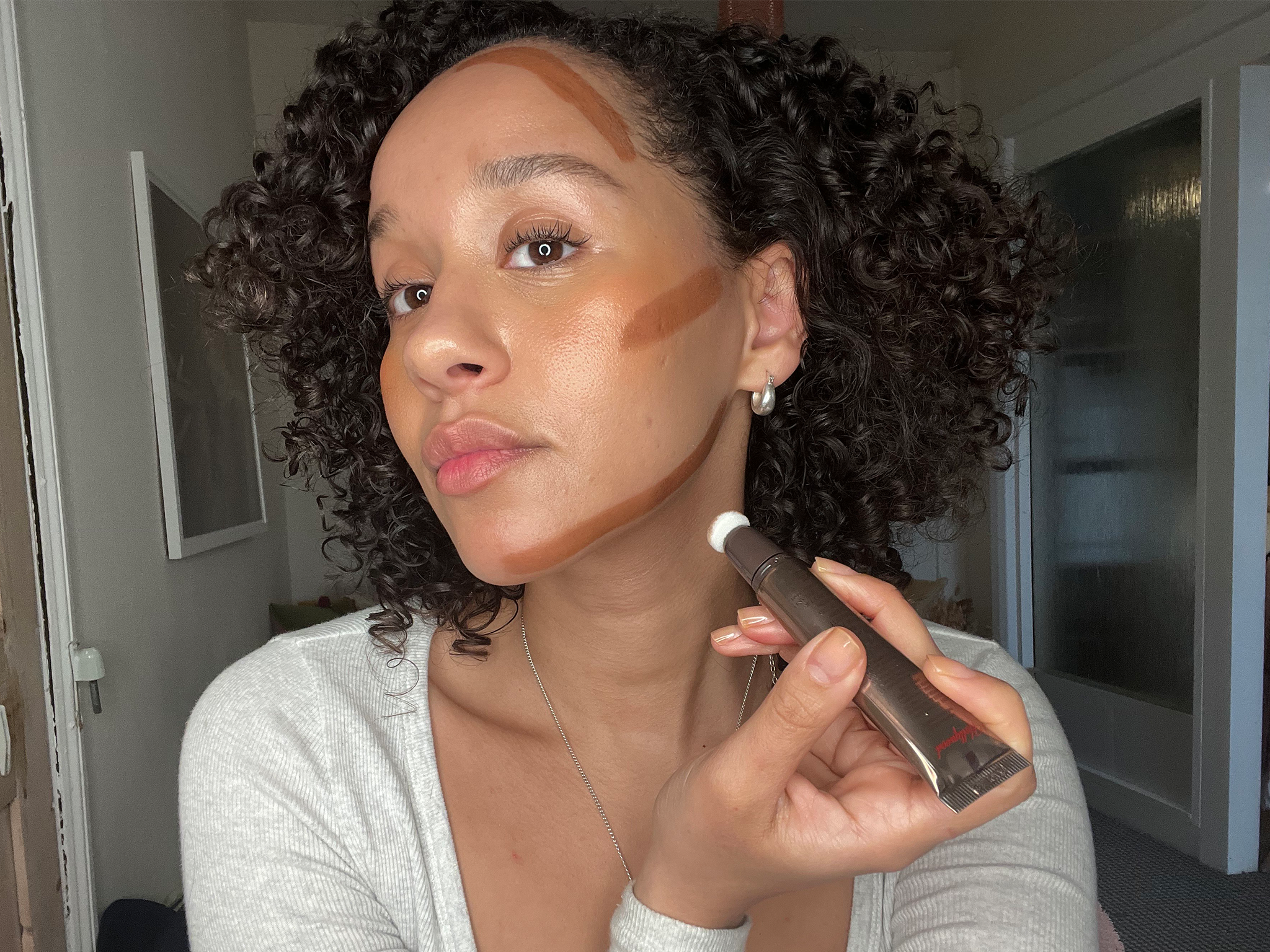 I compared the original medium-deep shade with the new tan option