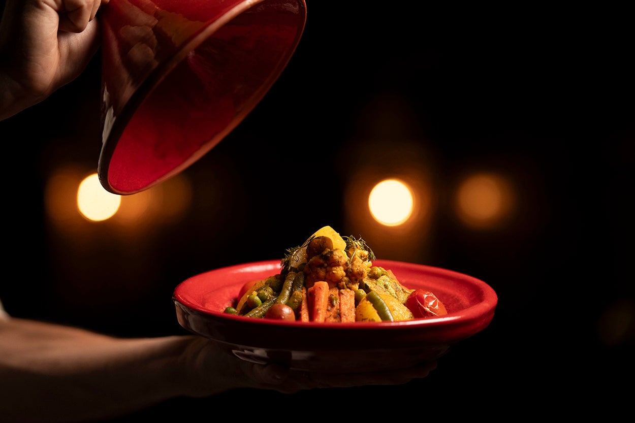 The unmistakable allure of a Moroccan tagine, where aromatic spices meet slow-cooked perfection
