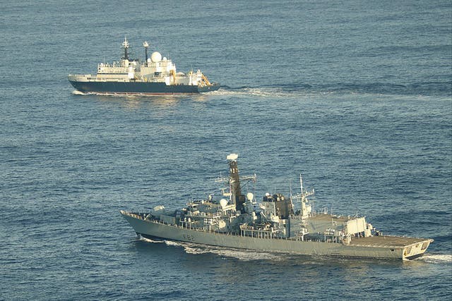 <p>HMS Somerset flanks the Russian ship Yanter near UK waters in November </p>