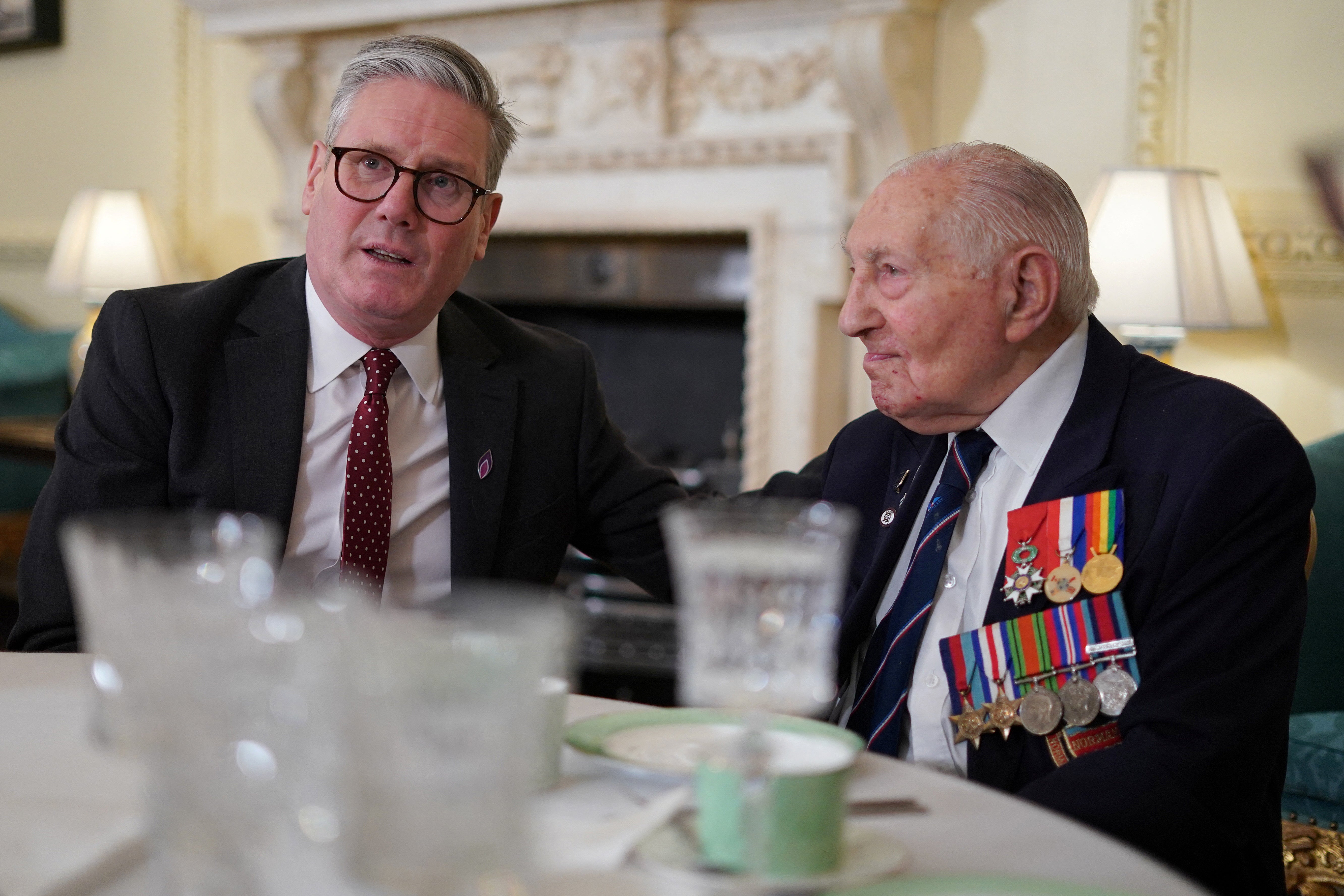 Prime minister Keir Starmer speaks to Second World War veteran Mervyn Kersh as they attend a reception in Downing Street to mark Holocaust Memorial Day in January