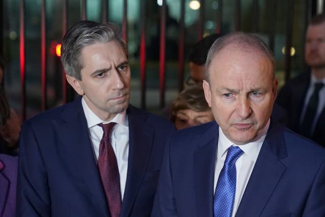 Fine Gael leader Simon Harris TD (left) and Fianna Fail leader Micheal Martin address the media outside Government Buildings in Dublin (Brian Lawless/PA)