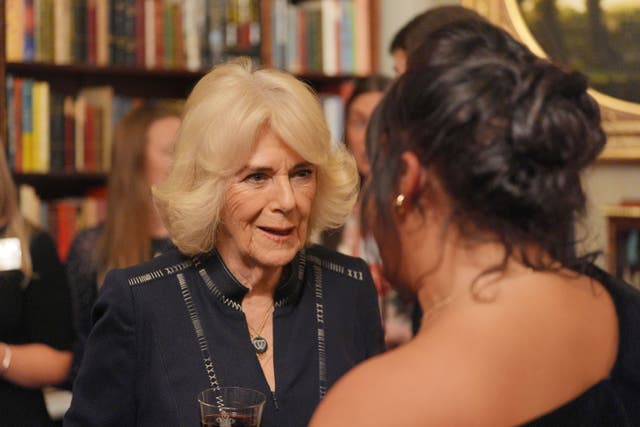 Queen Camilla speaks to guests as she hosts a reception at Clarence House (PA)