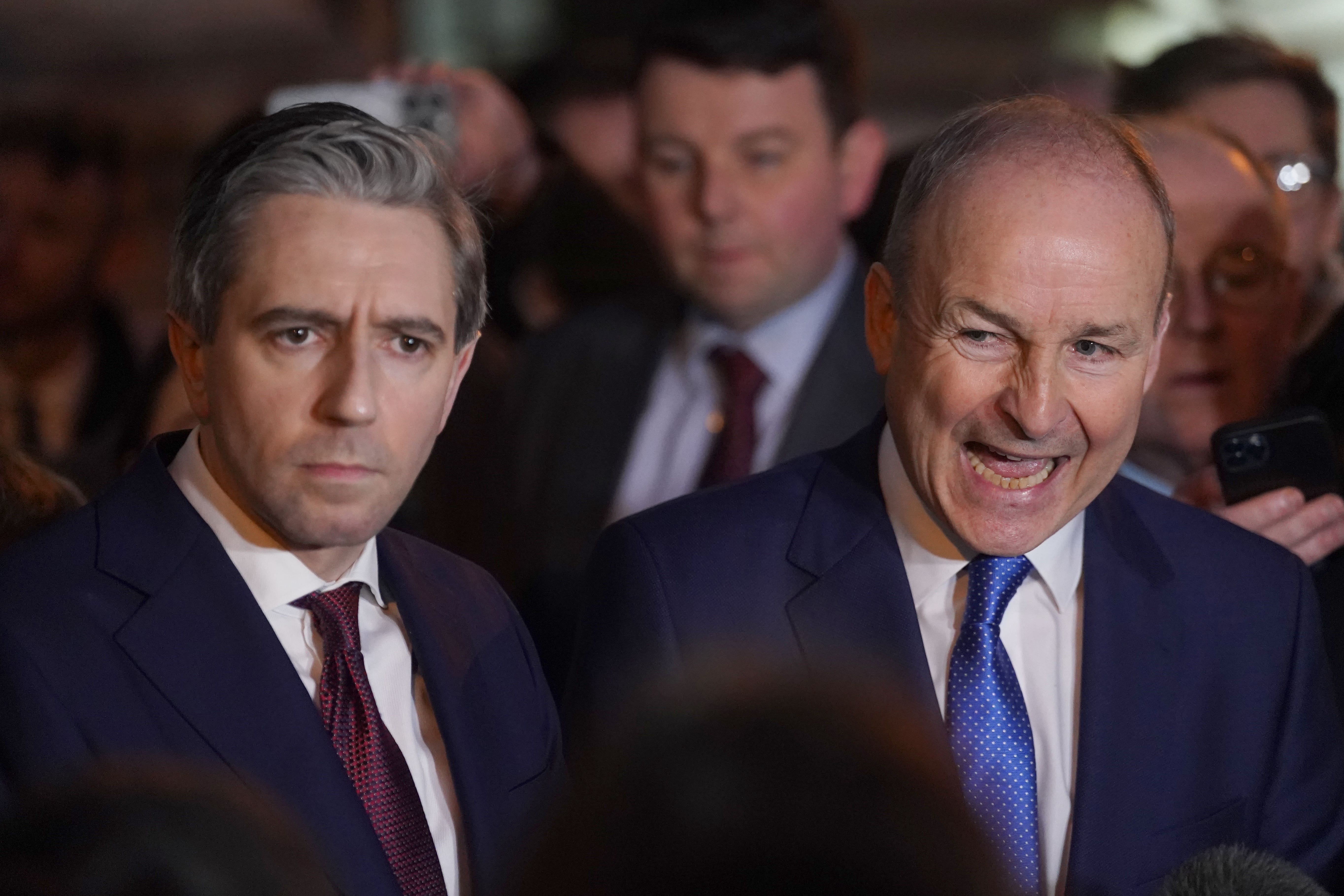 Fine Gael leader Simon Harris and Fianna Fail leader Micheal Martin (PA)