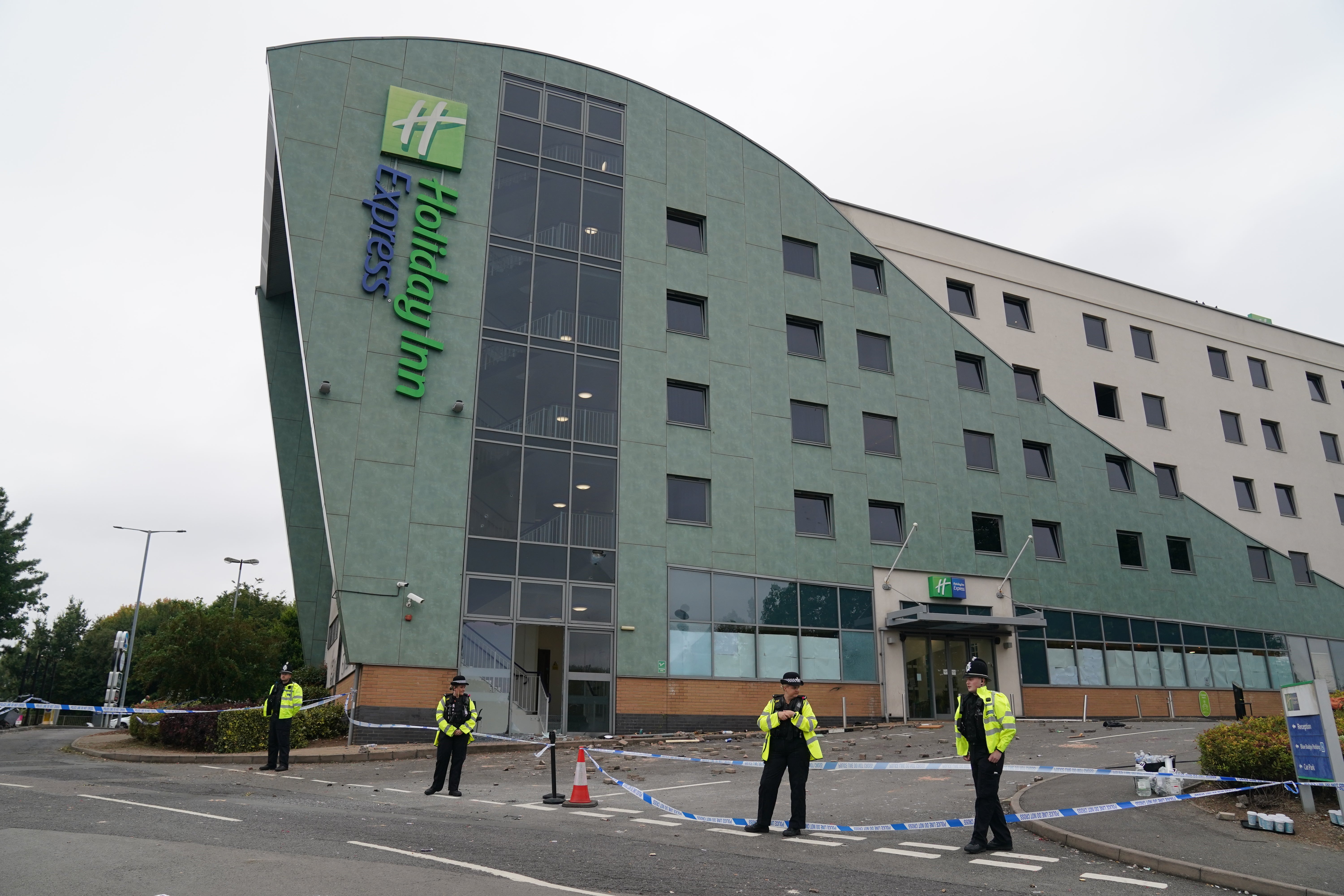 Police officers guarding Holiday Inn Express in Tamworth a day after the trouble broke out
