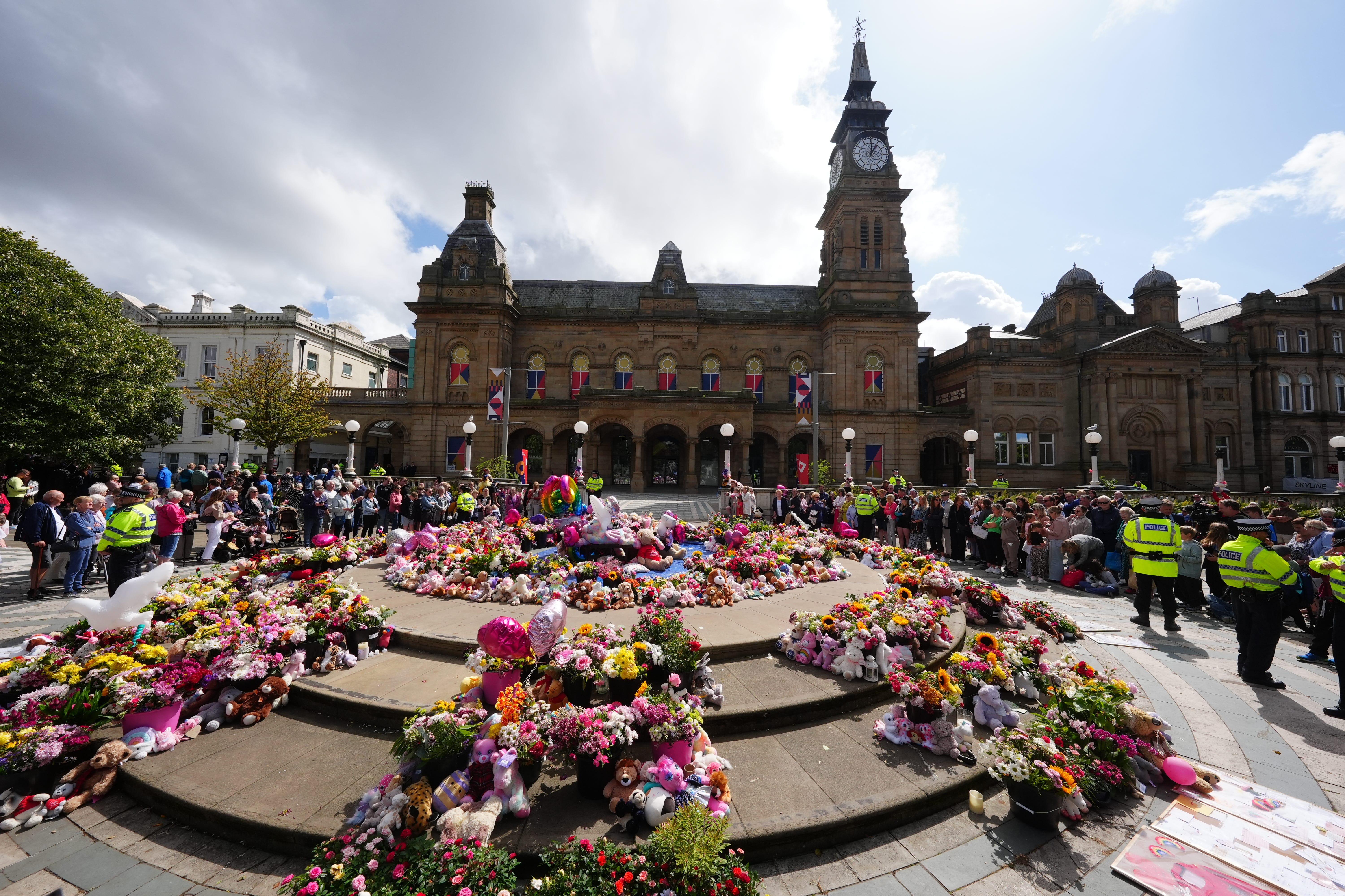 Flowers and tributes outside the Atkinson Art Centre, Southport (Owen Humphreys / PA)
