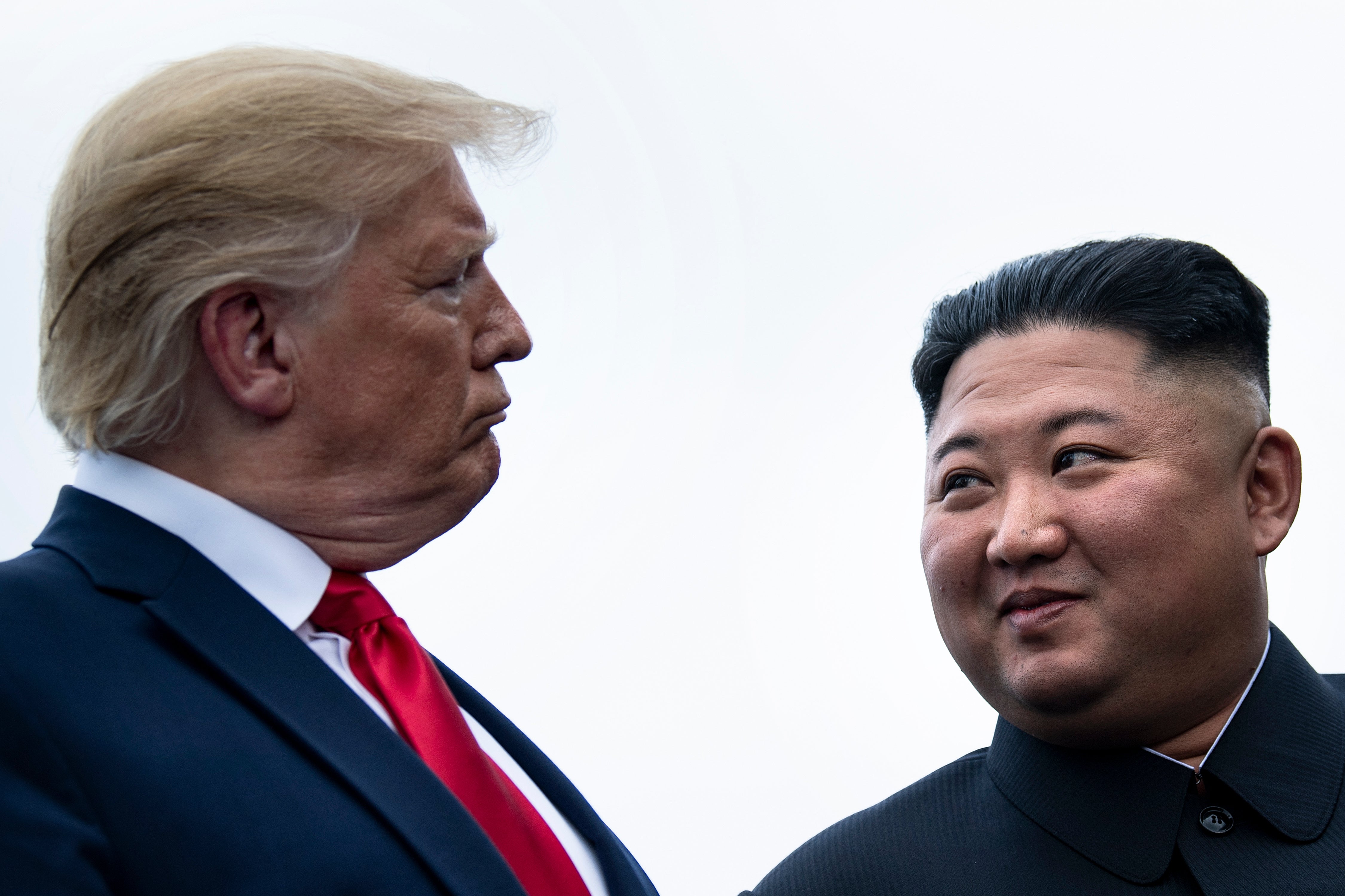 <p>File. US president Donald Trump and North Korean leader Kim Jong Un talk before a meeting in the Demilitarized Zone in Panmunjom on 30 June 2019</p>