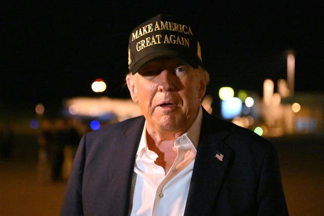 <p>Donald Trump speaks to reporters before boarding Air Force One at Los Angeles international airport in Los Angeles, California, on 24 January 2025</p>