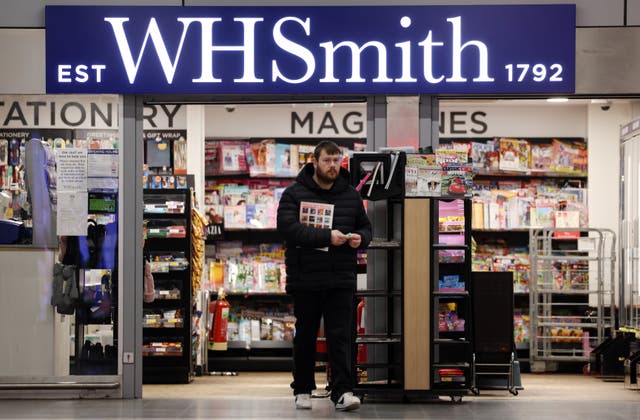 <p>A customer at a WHSmith store in London </p>