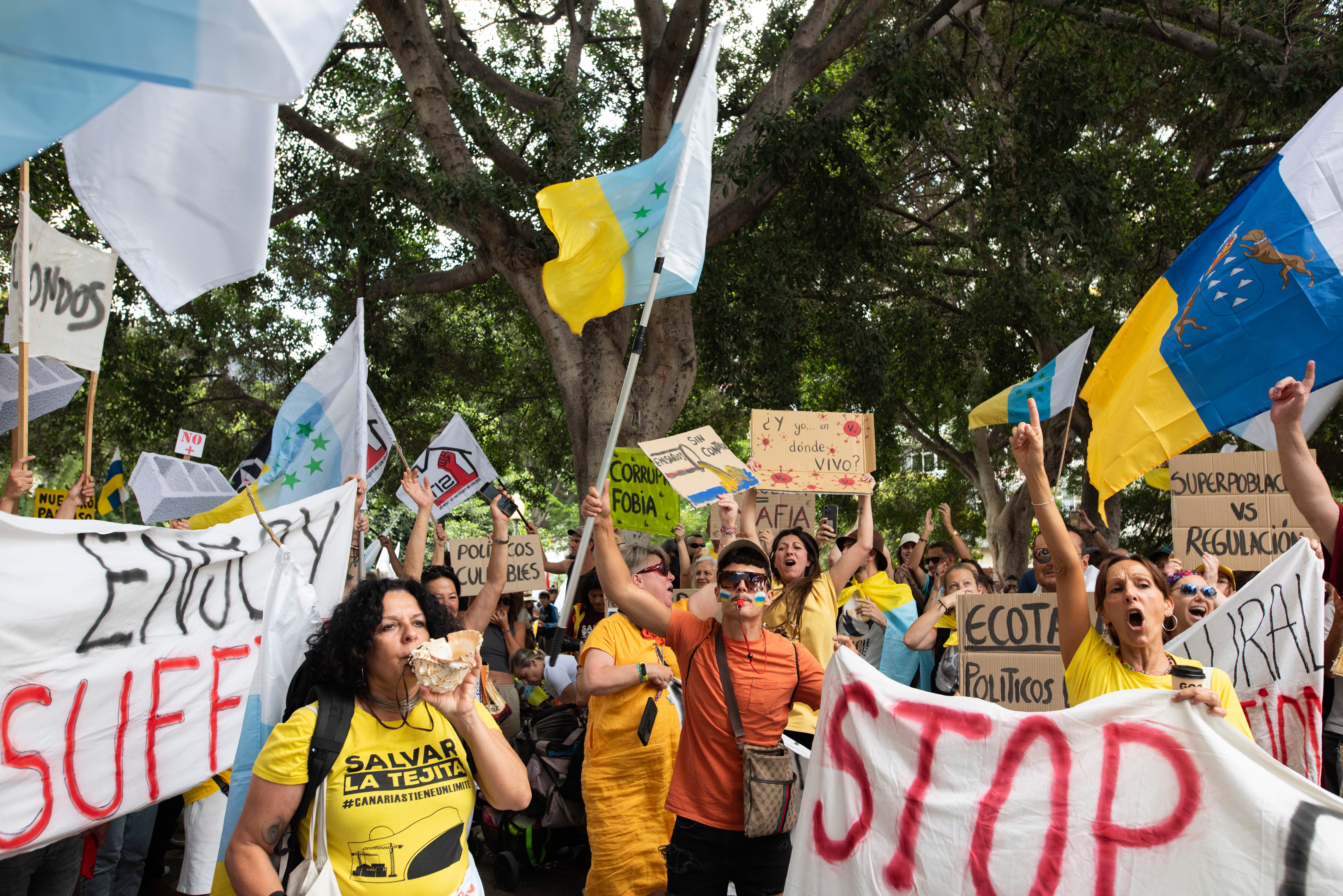 People march during a mass demonstration against over tourism in Santa Cruz de Tenerife, Spain, April 20, 2024