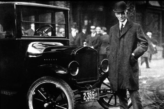 <p>American industrialist Henry Ford with his ‘universal’ Model T, which ‘put the world on wheels’</p>