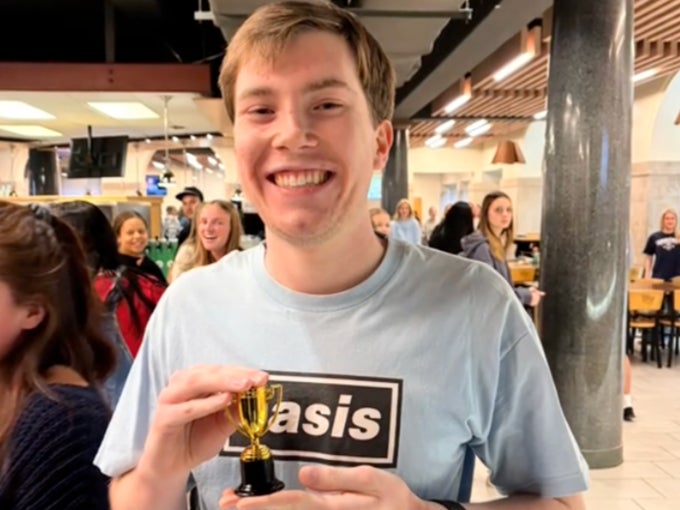 Cole got presented with a trophy by his friends after he walked the full marathon