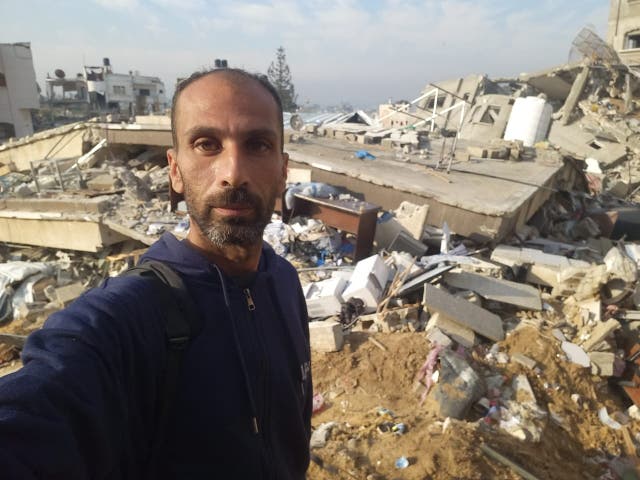 <p>Nedal Hamdouna, a Palestinian journalist, returns to his destroyed family home in north Gaza</p>