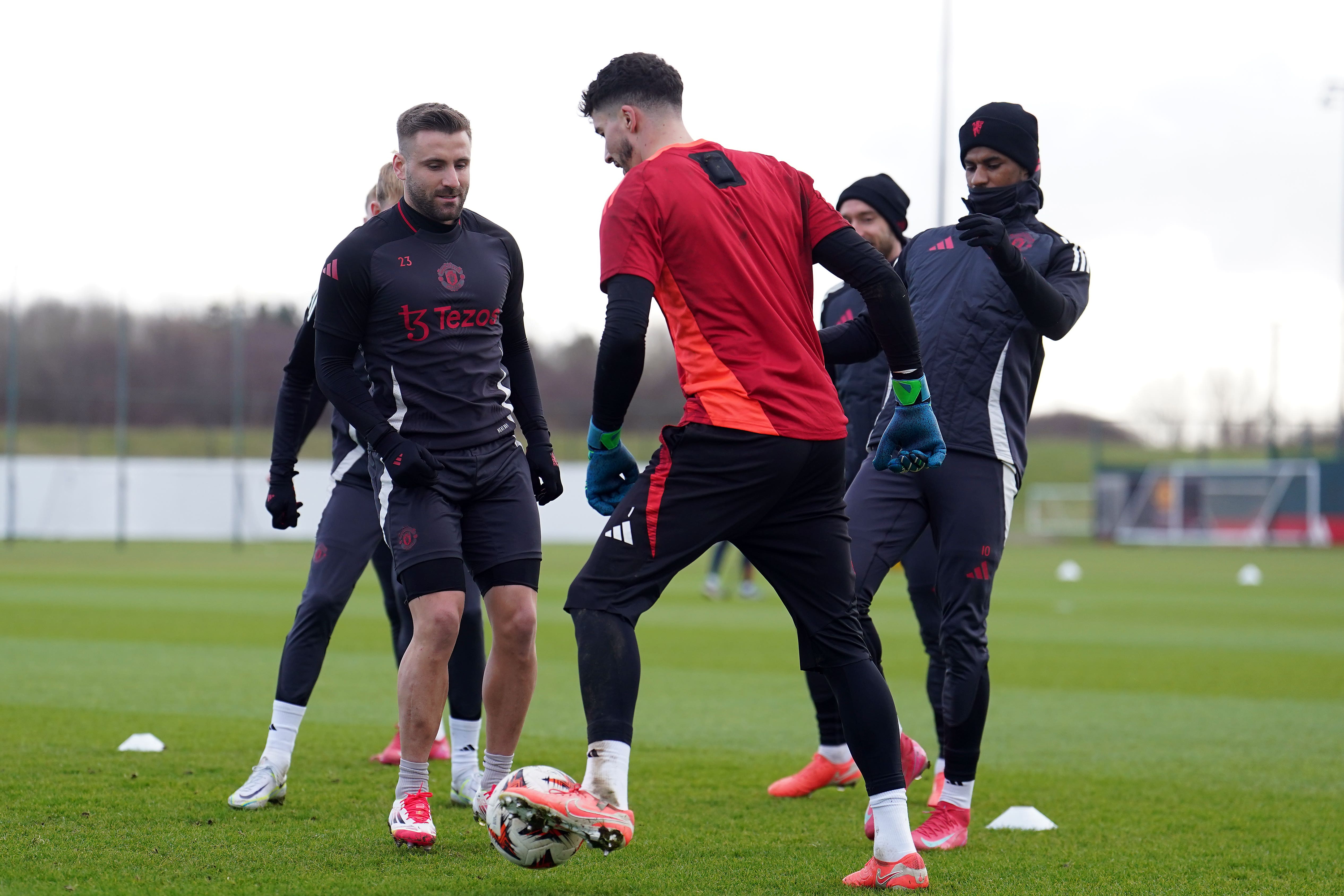 Shaw (left) and Marcus Rashford (right) trained with the squad but will not make trip to FCSB (Martin Rickett/PA)