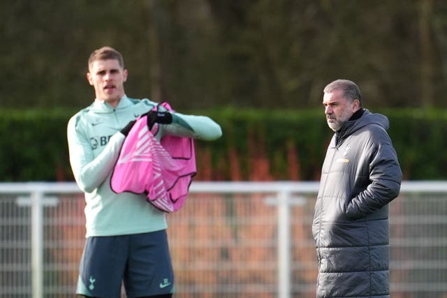 Micky van de Ven with Tottenham head coach Ange Postecoglou (Adam Davy/PA)