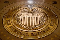 Fed hold rates steady, says job market is 'solid' while inflation 'remains somewhat elevated'