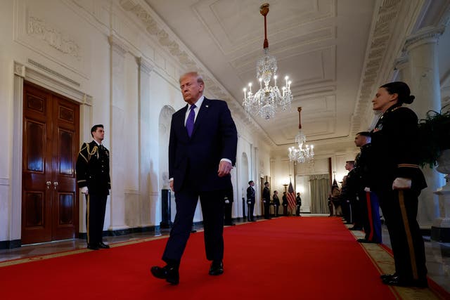 <p>President Donald Trump walks into the East Room before signing the Laken Riley Act, the first piece of legislation passed during his second term in office</p>