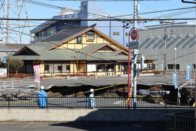 <p>This photo shows a general view of a collapsed road at a prefectural road intersection, in the city of Yashio, Saitama Prefecture on 30 January 2025</p>