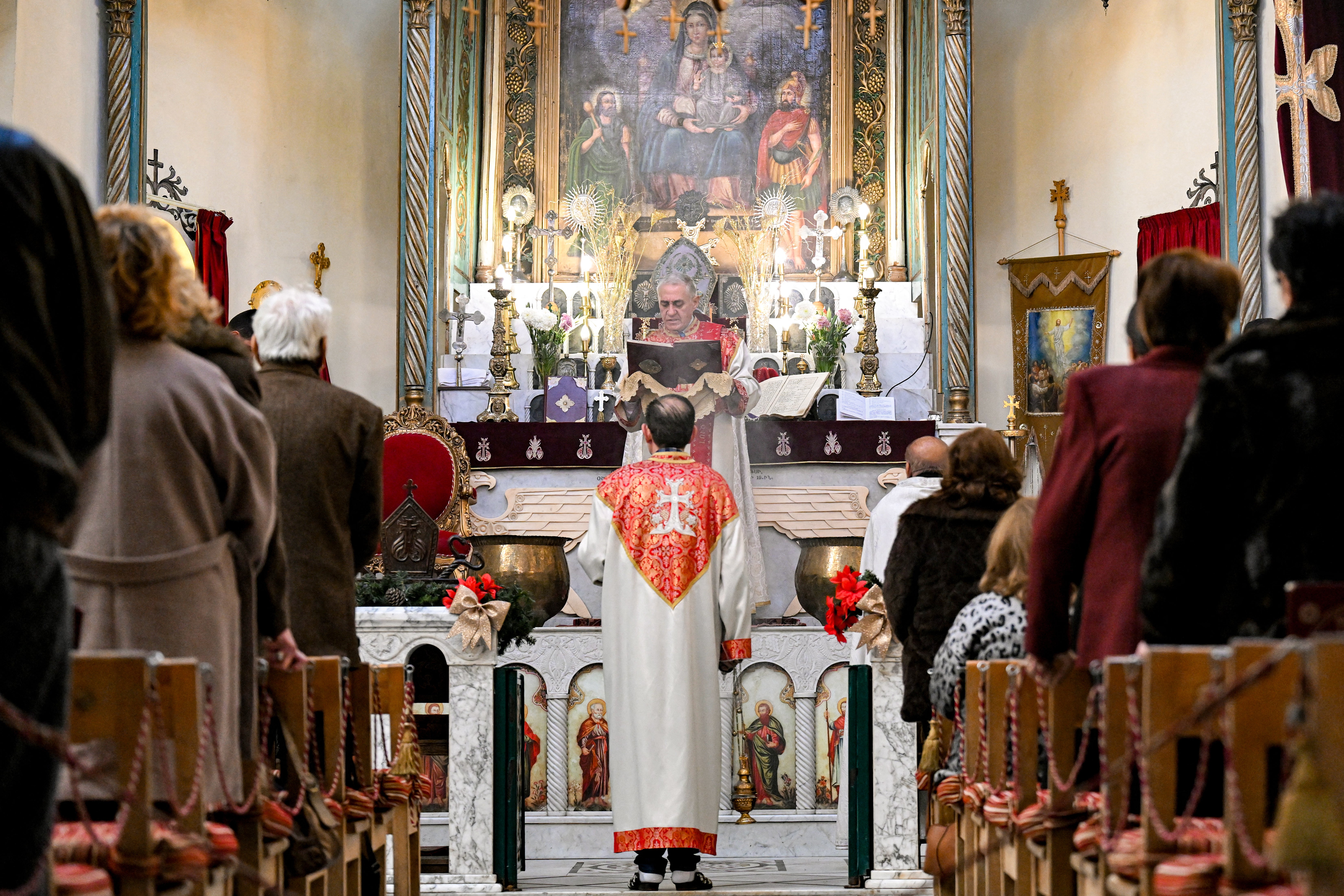 Worshippers attend a service at the Armenian Apostolic Church of Mar Sarkis in Damascus