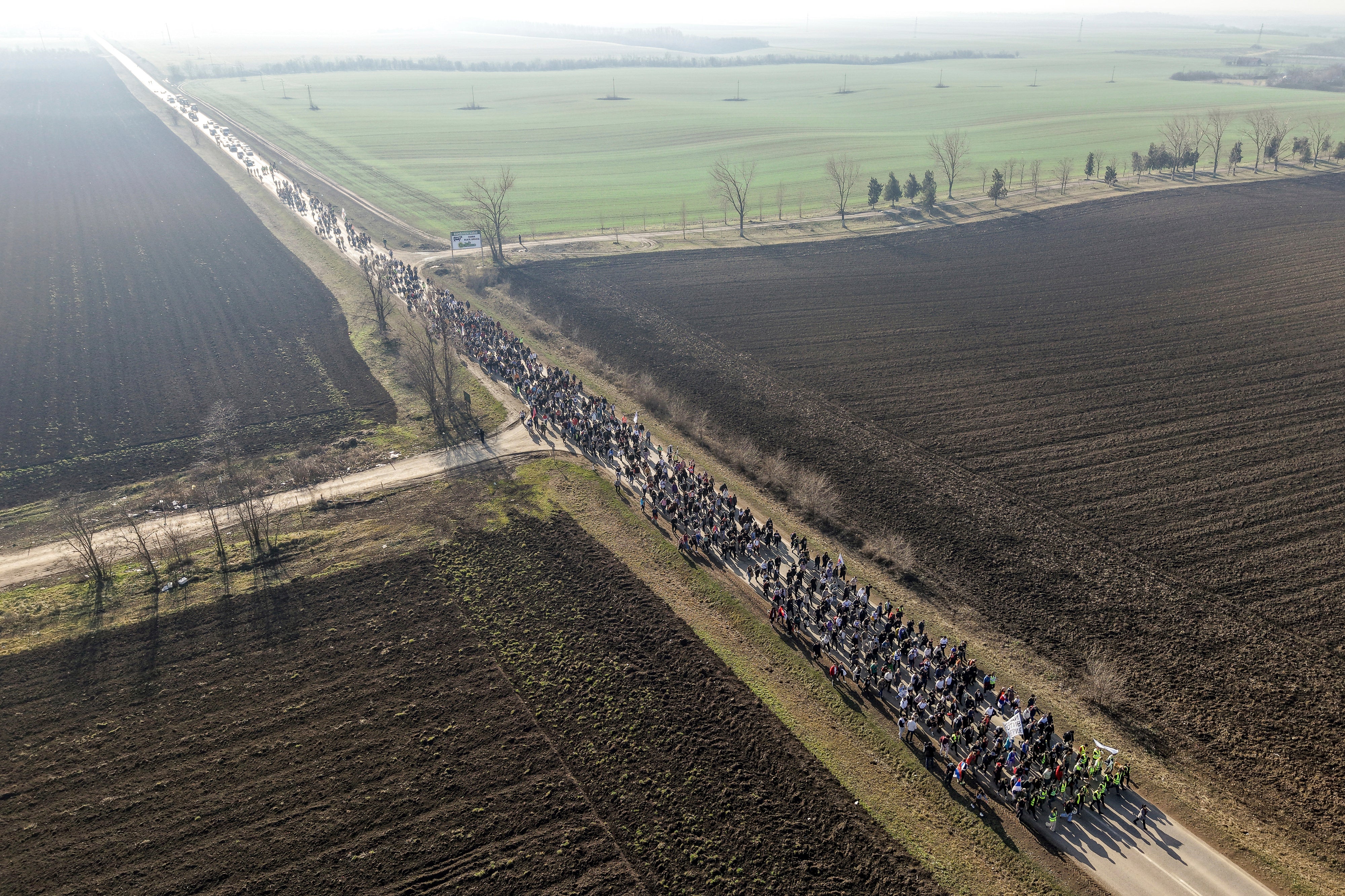Students march trough the fields in northern Serbia in January as they protest over the collapse of a concrete canopy